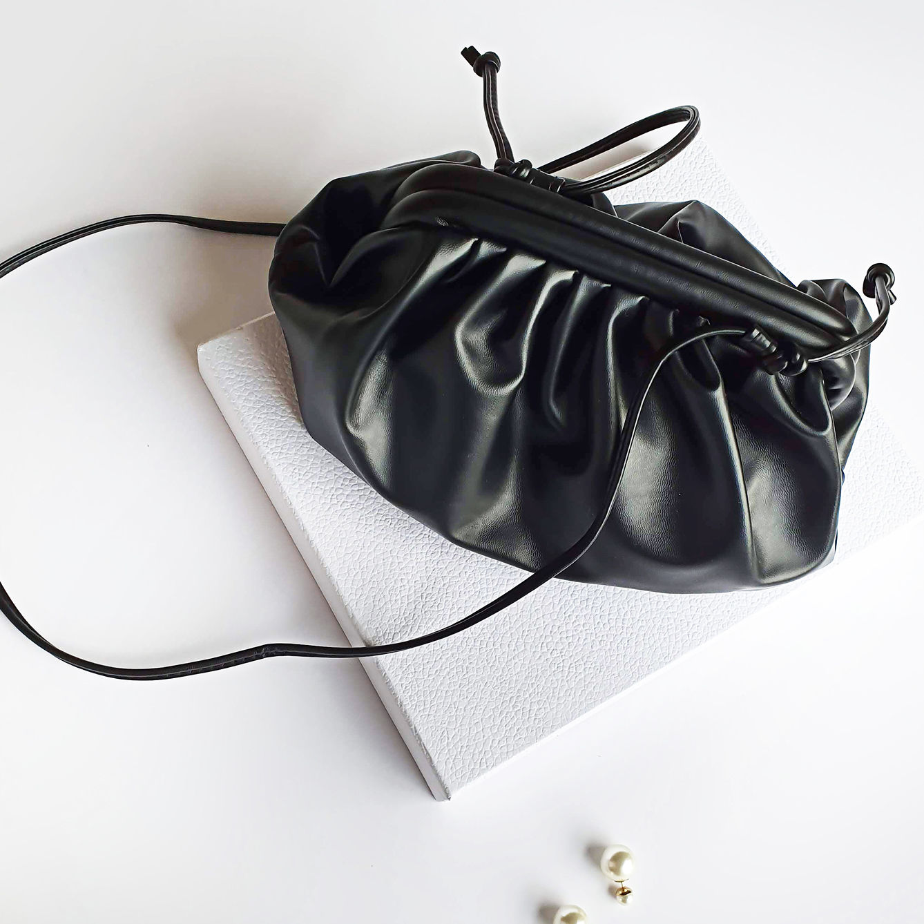 black drawstring evening bag