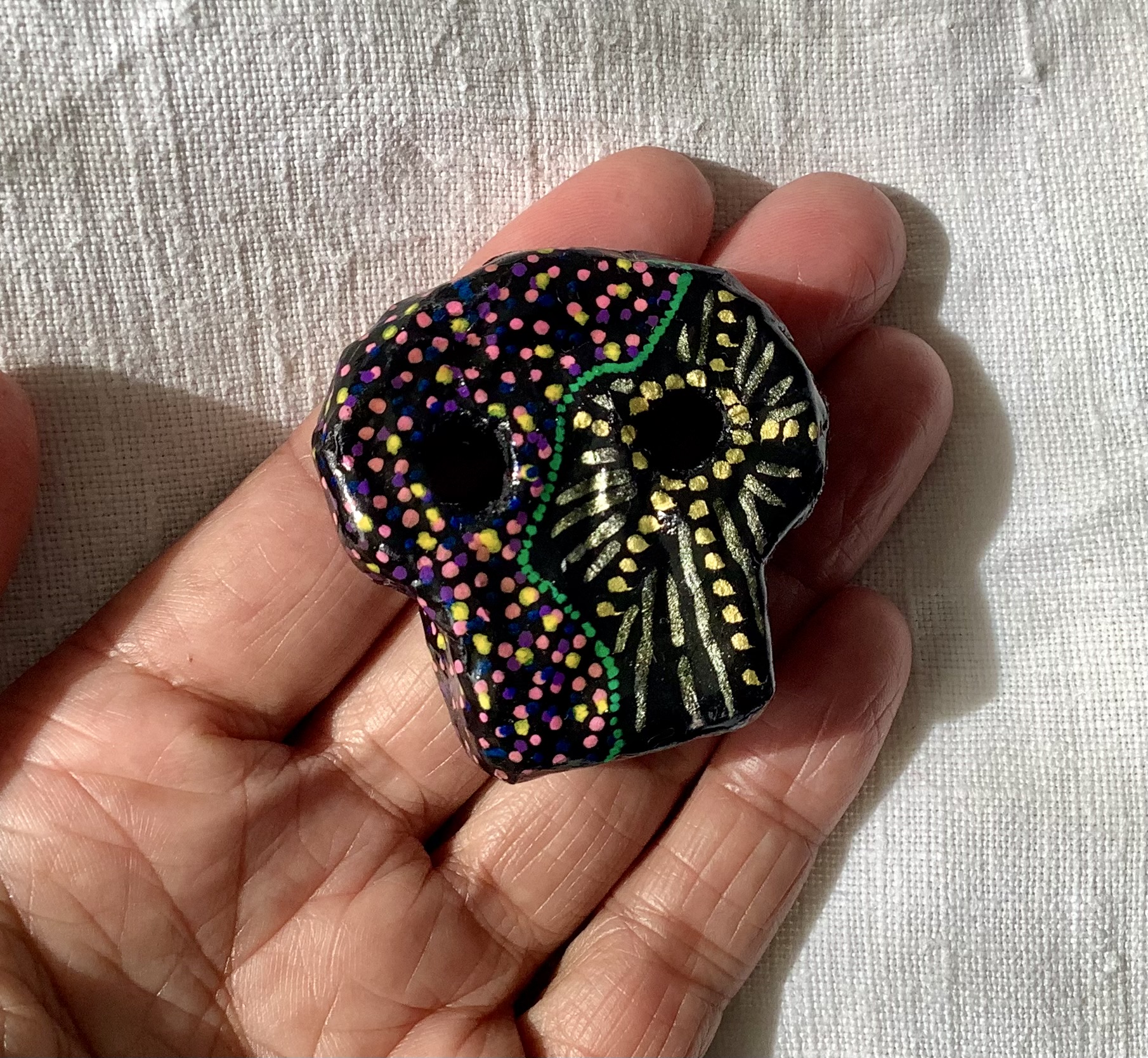 Skull brooch