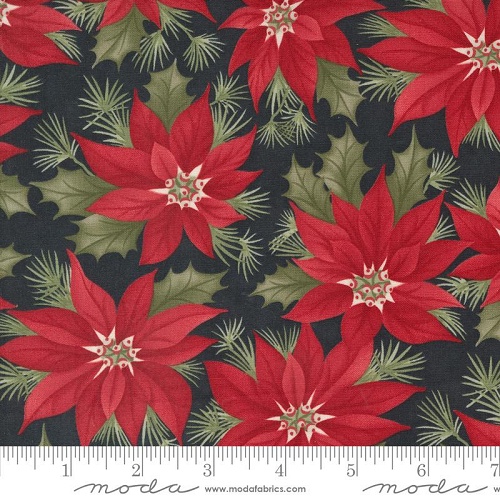 Fabric with red pointsettias on a black background.