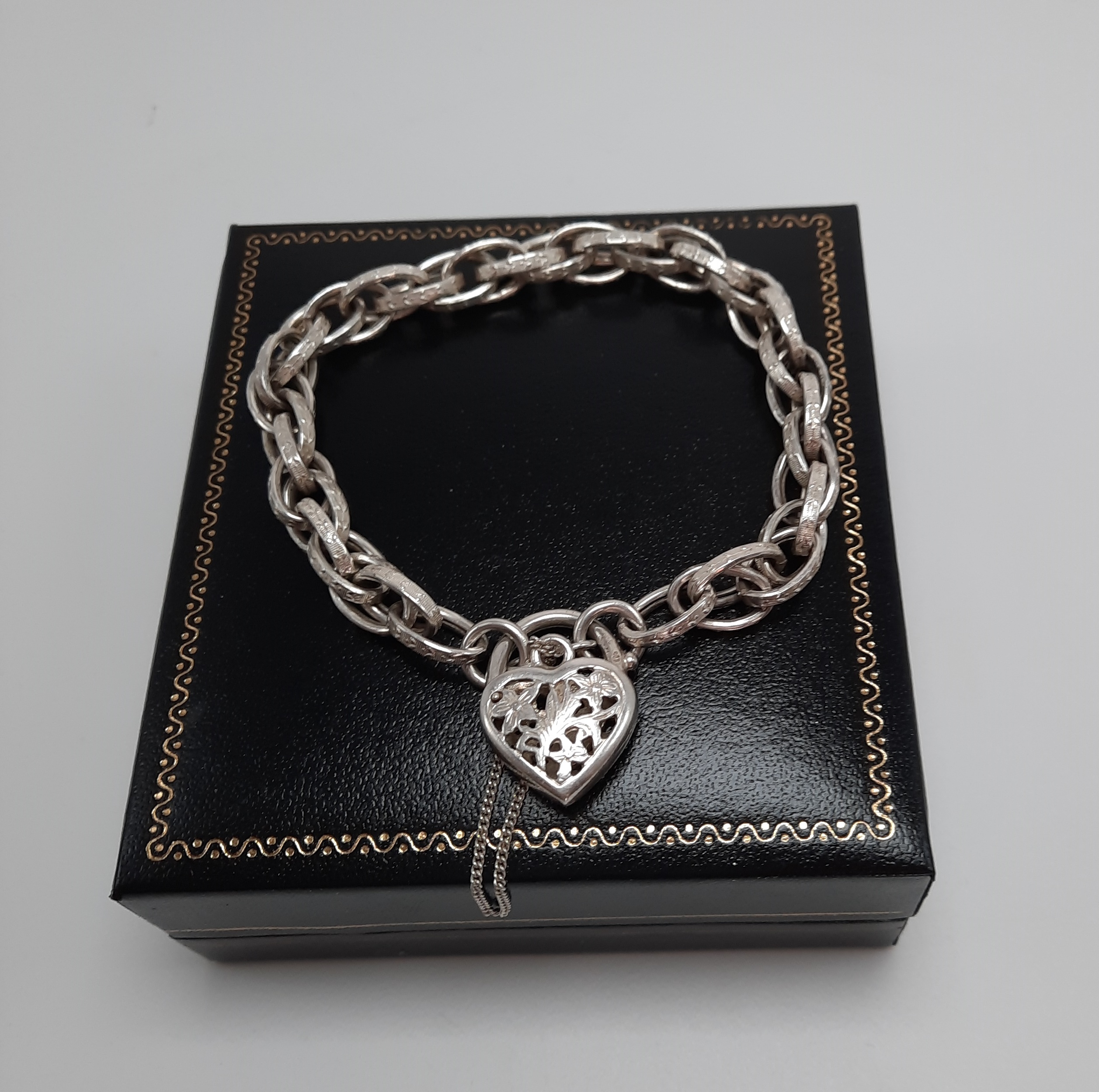 Sterling Silver Fancy Link Bracelet with Floral Pierced Padlock