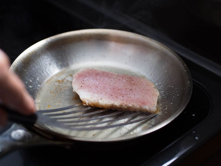 Why does fish curl while cooking?