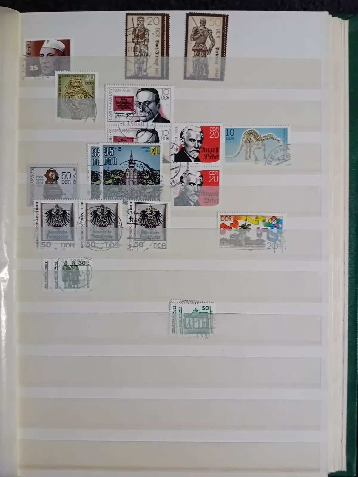 E Germany DDR used stamps in 15 page/30 side album only 10 pages have stamps