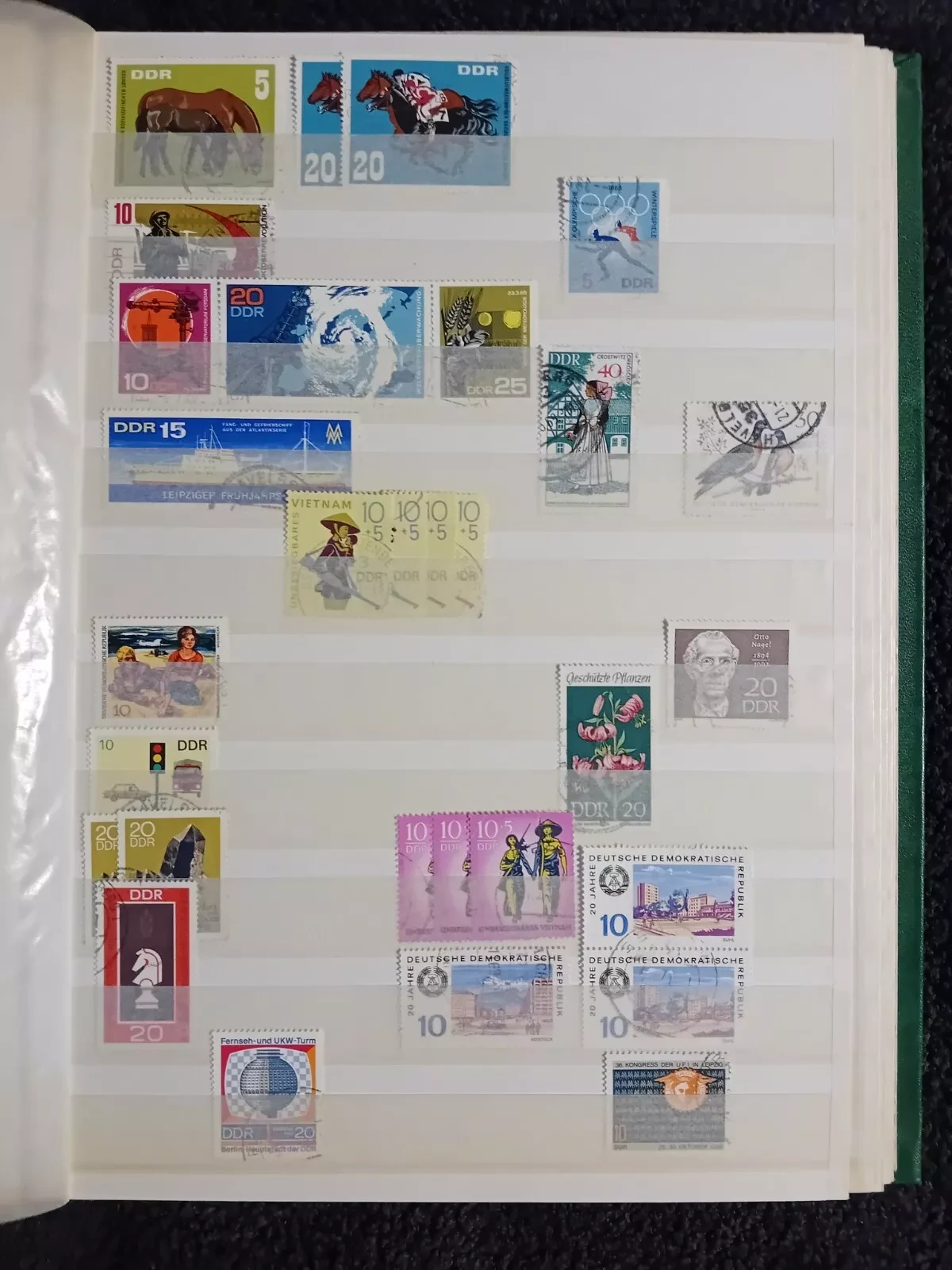 E Germany DDR used stamps in 15 page/30 side album only 10 pages have stamps