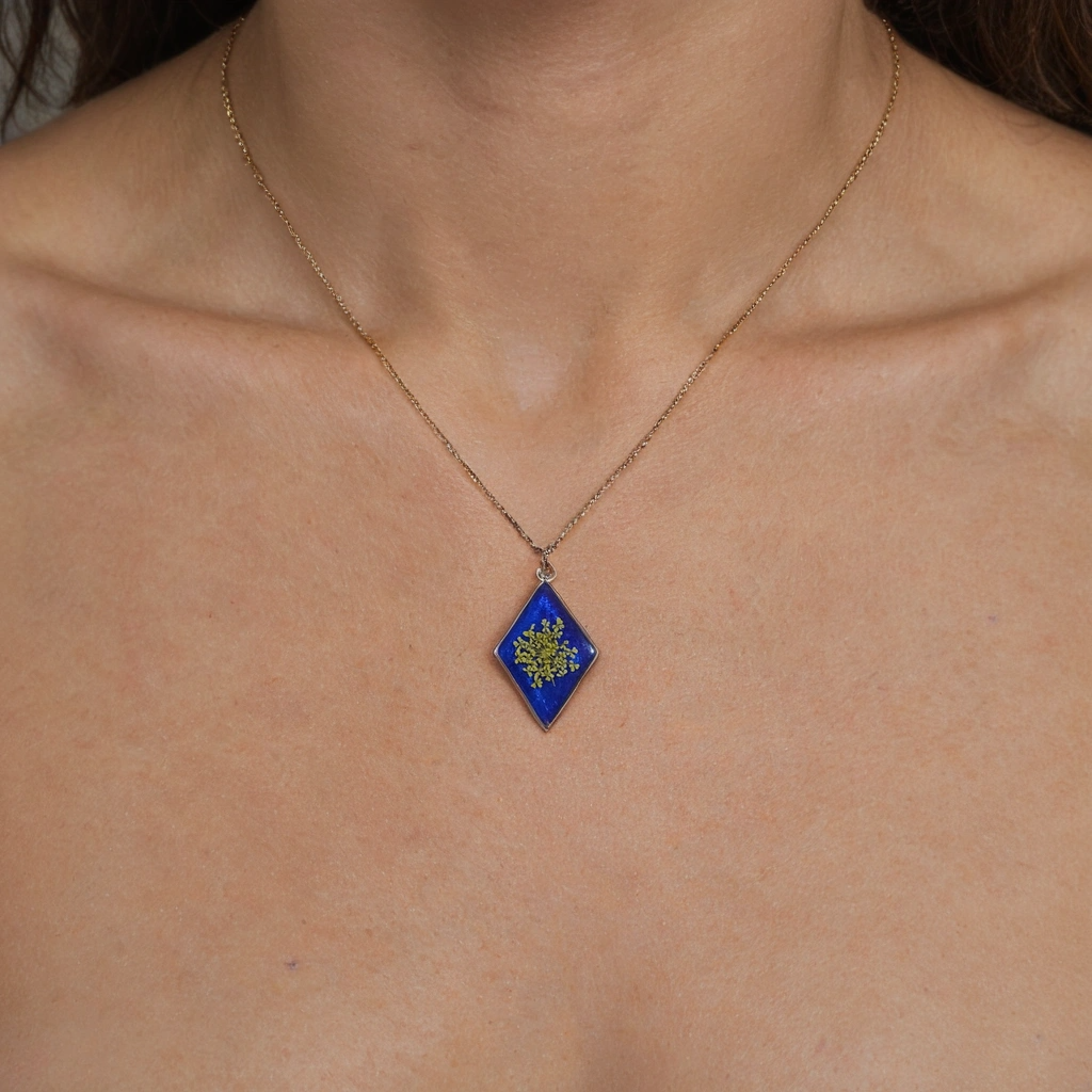 Vibrant Blue Resin Necklace with Pressed Yellow Flower