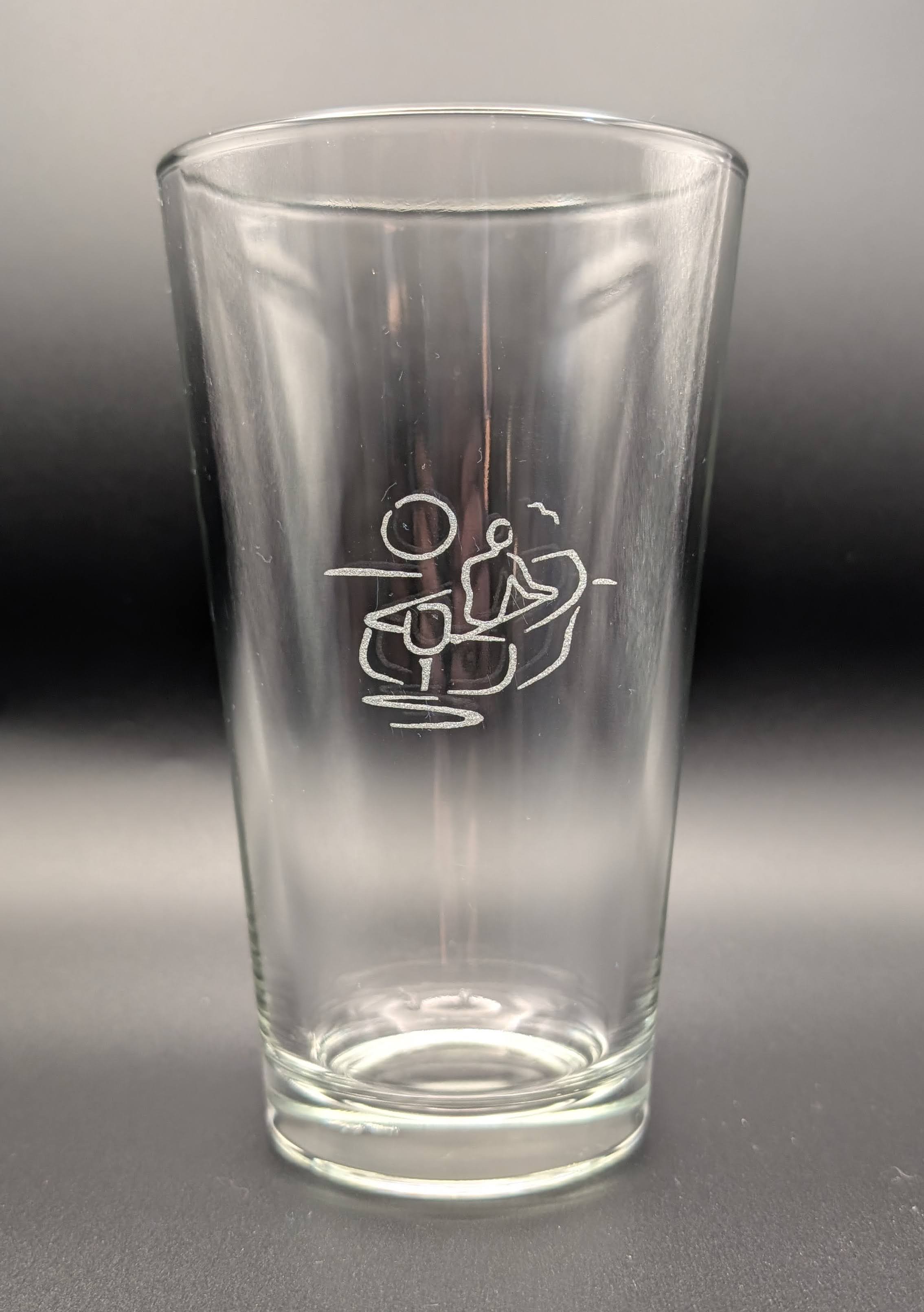 The Village logo pint glass