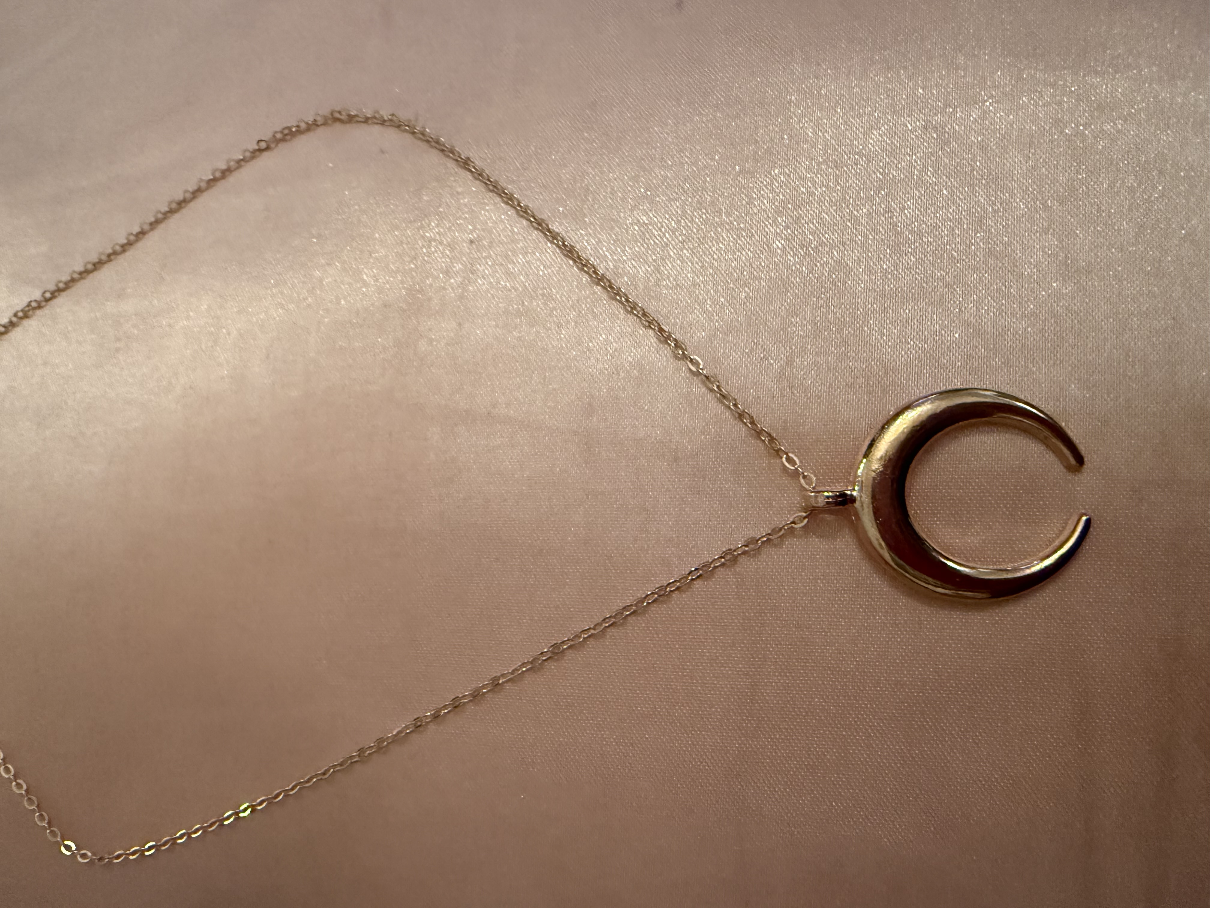 Golden tone/half moon necklace