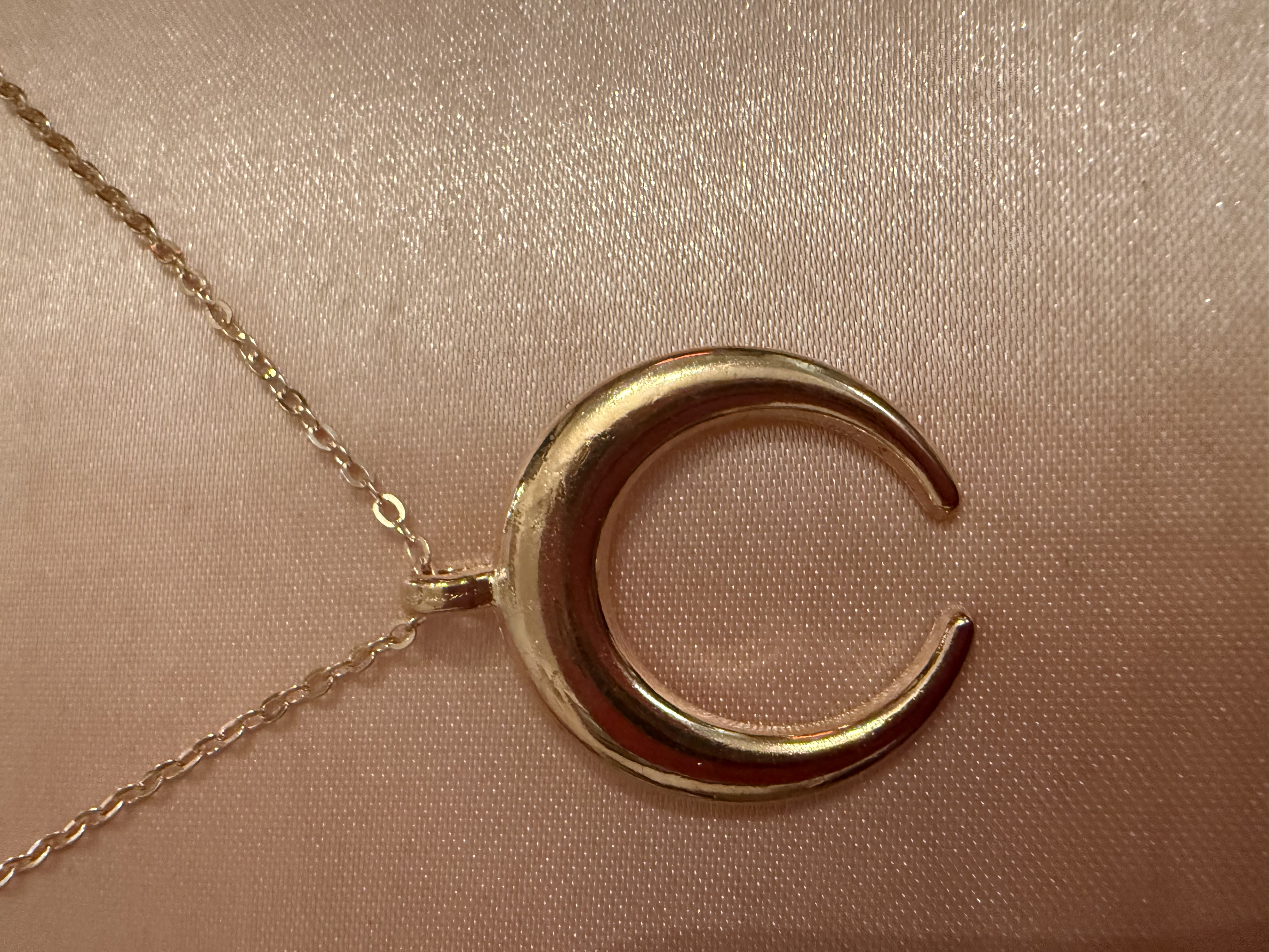 Golden tone/half moon necklace