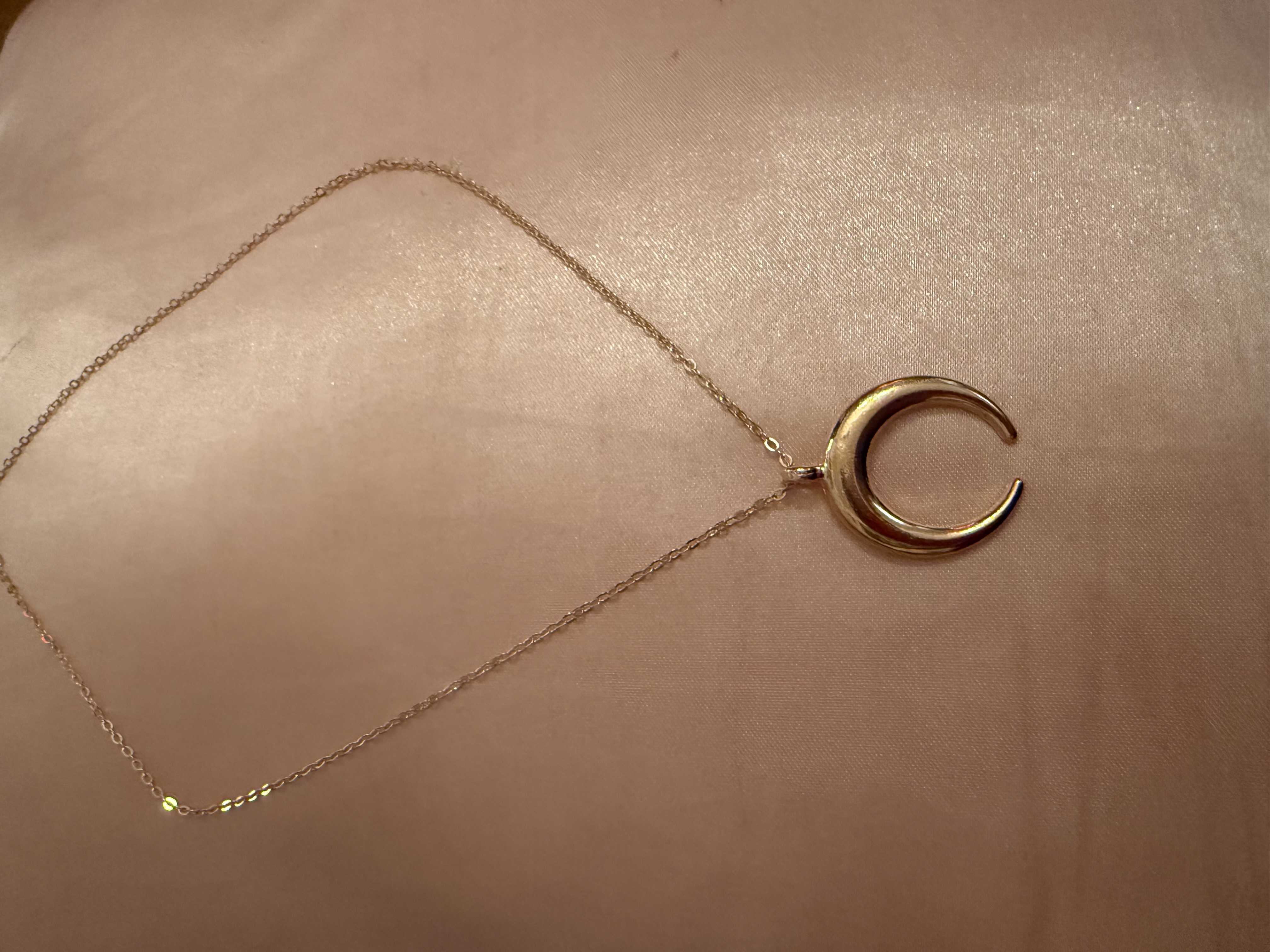 Golden tone/half moon necklace
