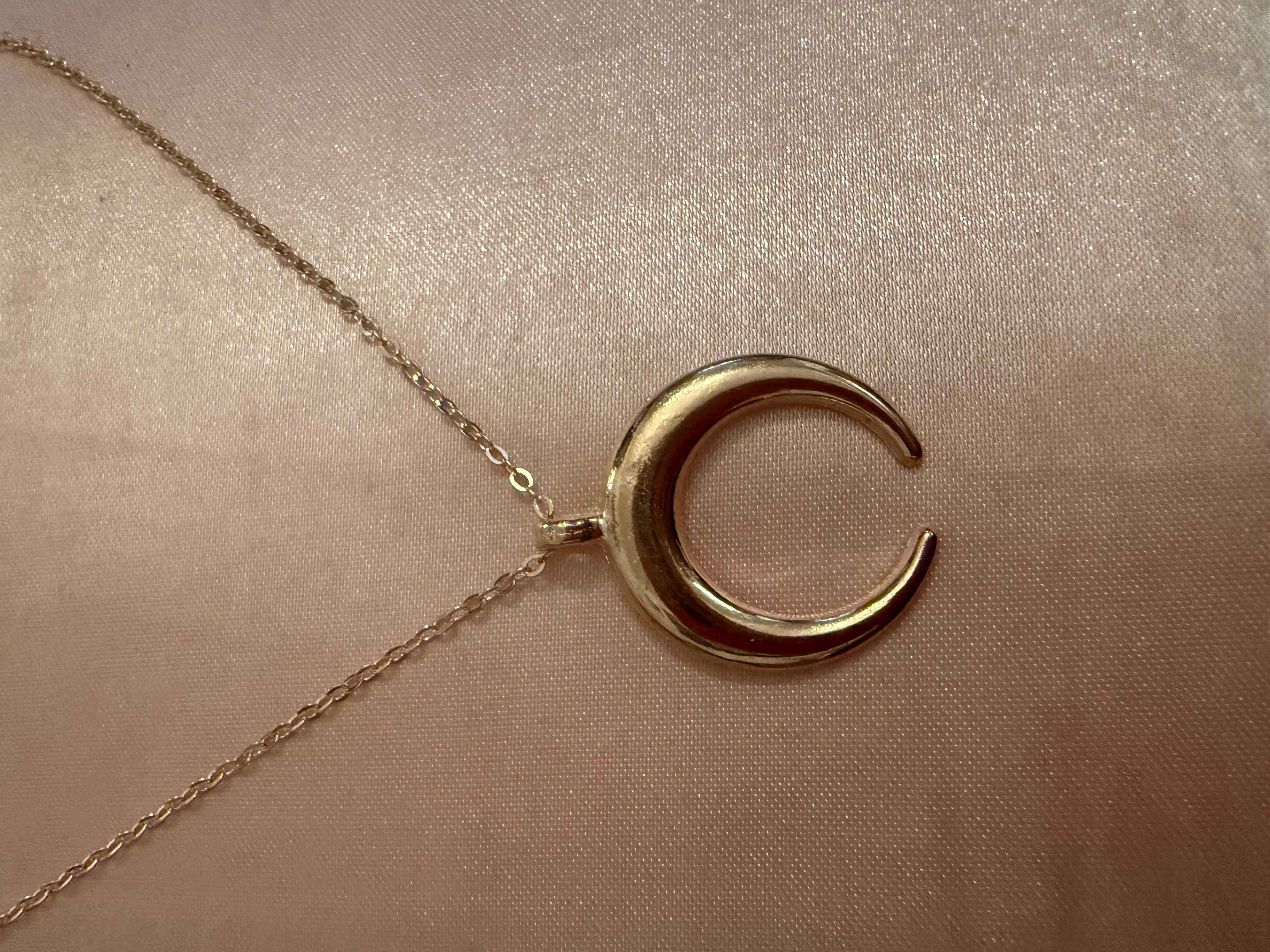 Golden tone/half moon necklace