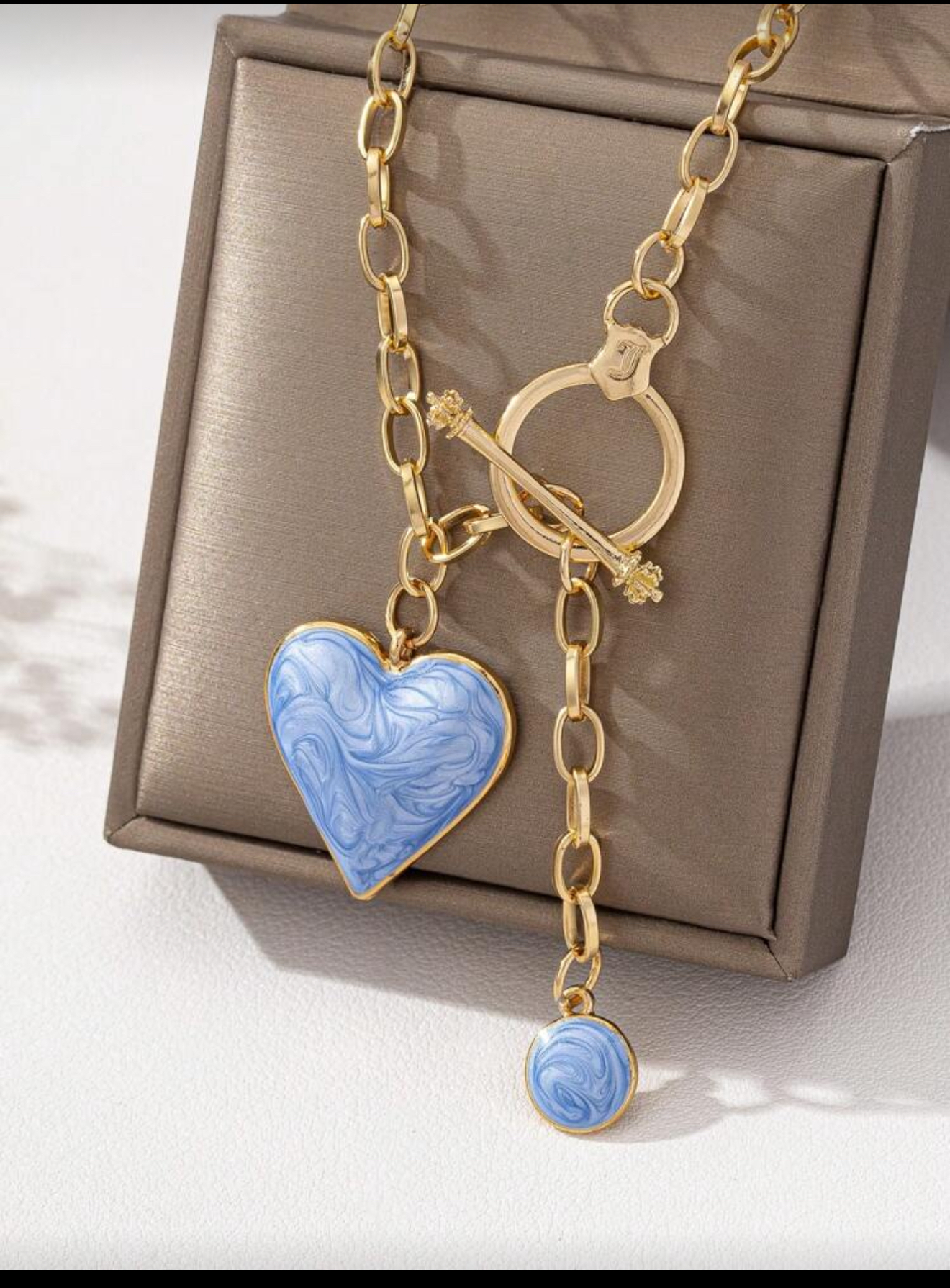 Blue heart & gold tone necklace