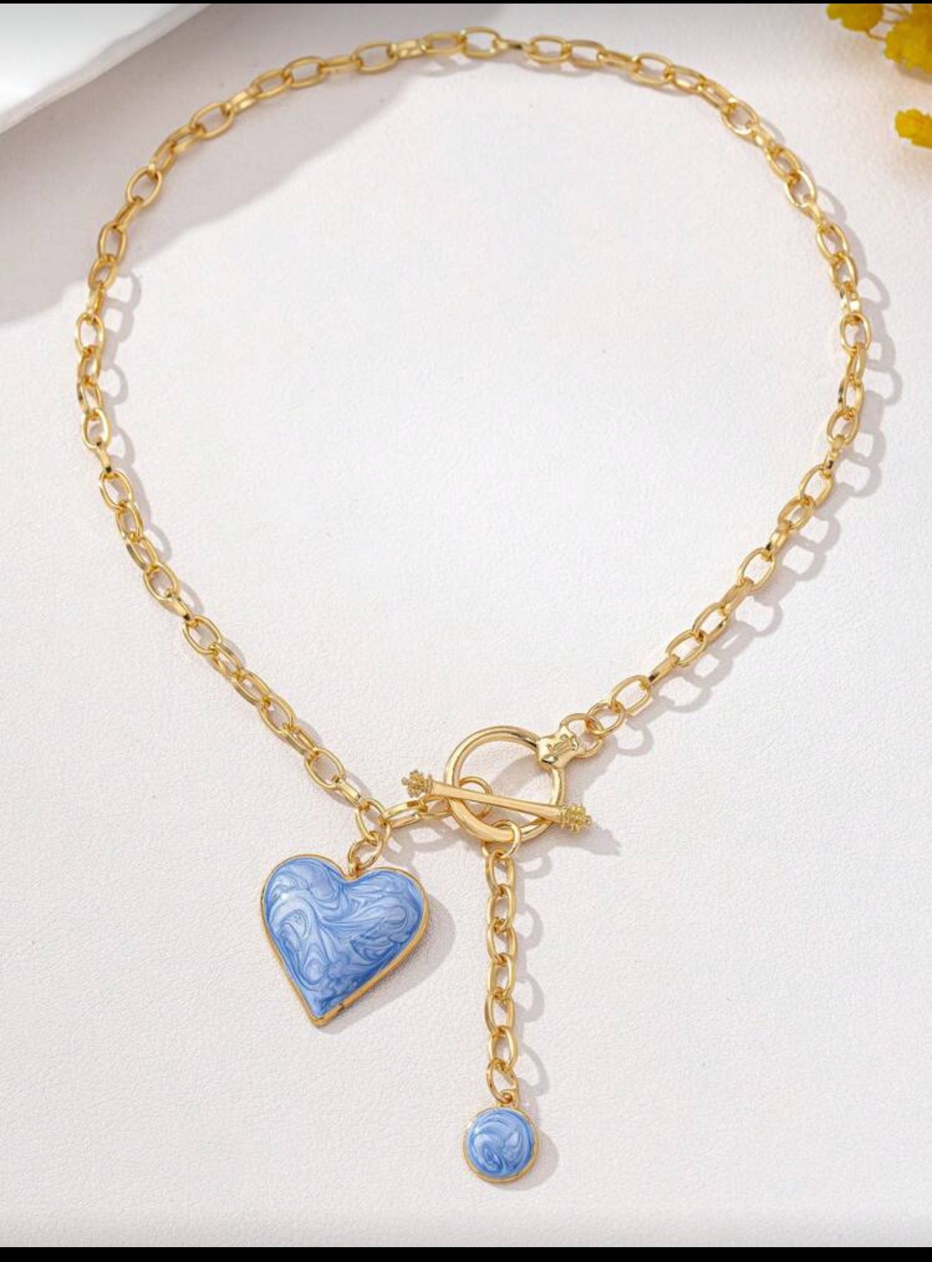 Blue heart & gold tone necklace