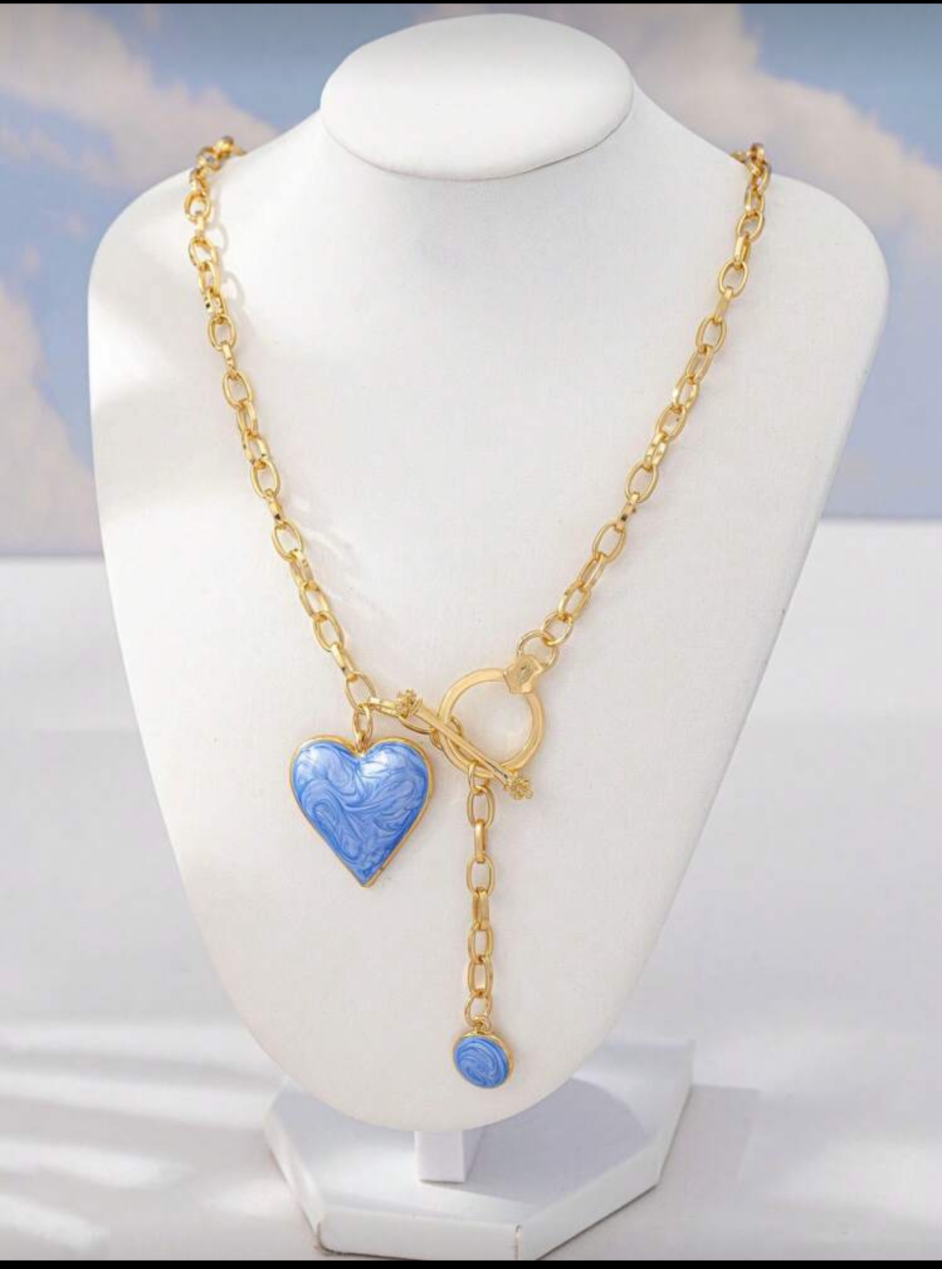 Blue heart & gold tone necklace