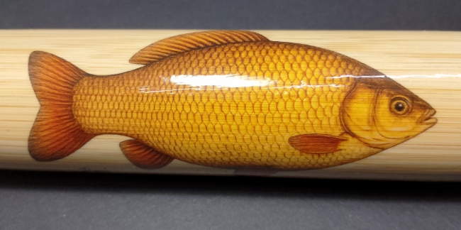 Bamboo fishing float tube with fish illustration