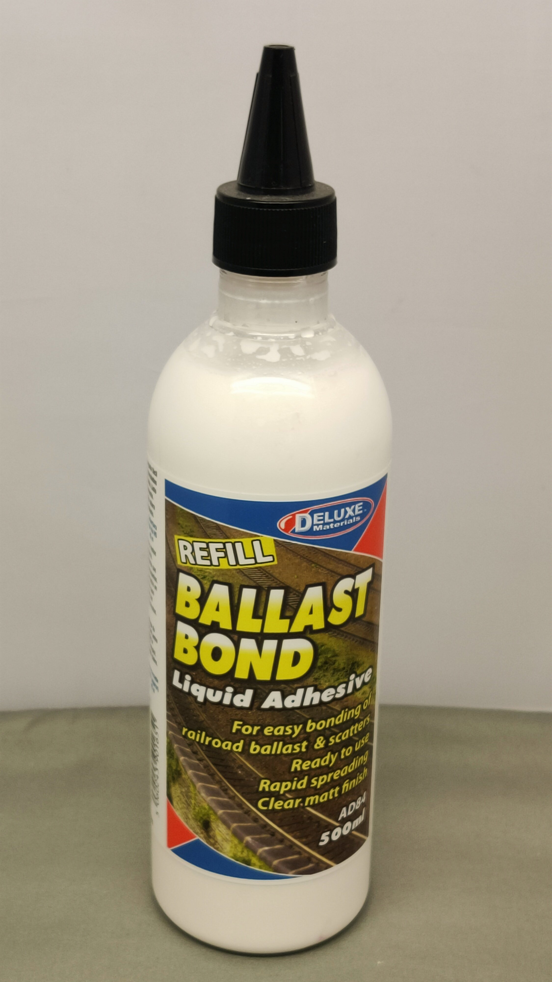 Deluxe Materials. Ballast bond refill liquid adhesive for ballasting track