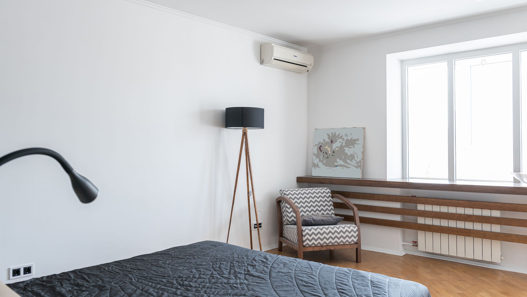 Bedroom with wall-mounted mini split heat pump