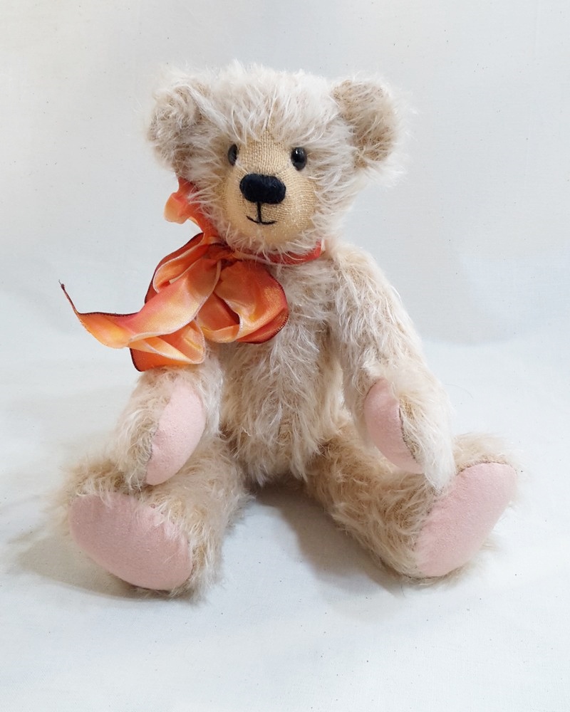 Handmade cream mohair Archie Bear with orange ribbon