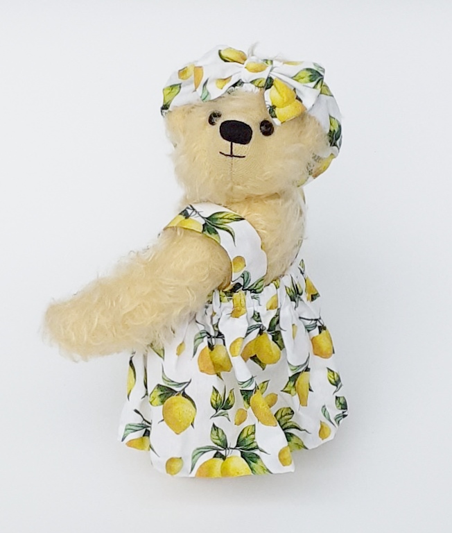 Handmade Archie Bear wearing a lemon print dress and matching hat
