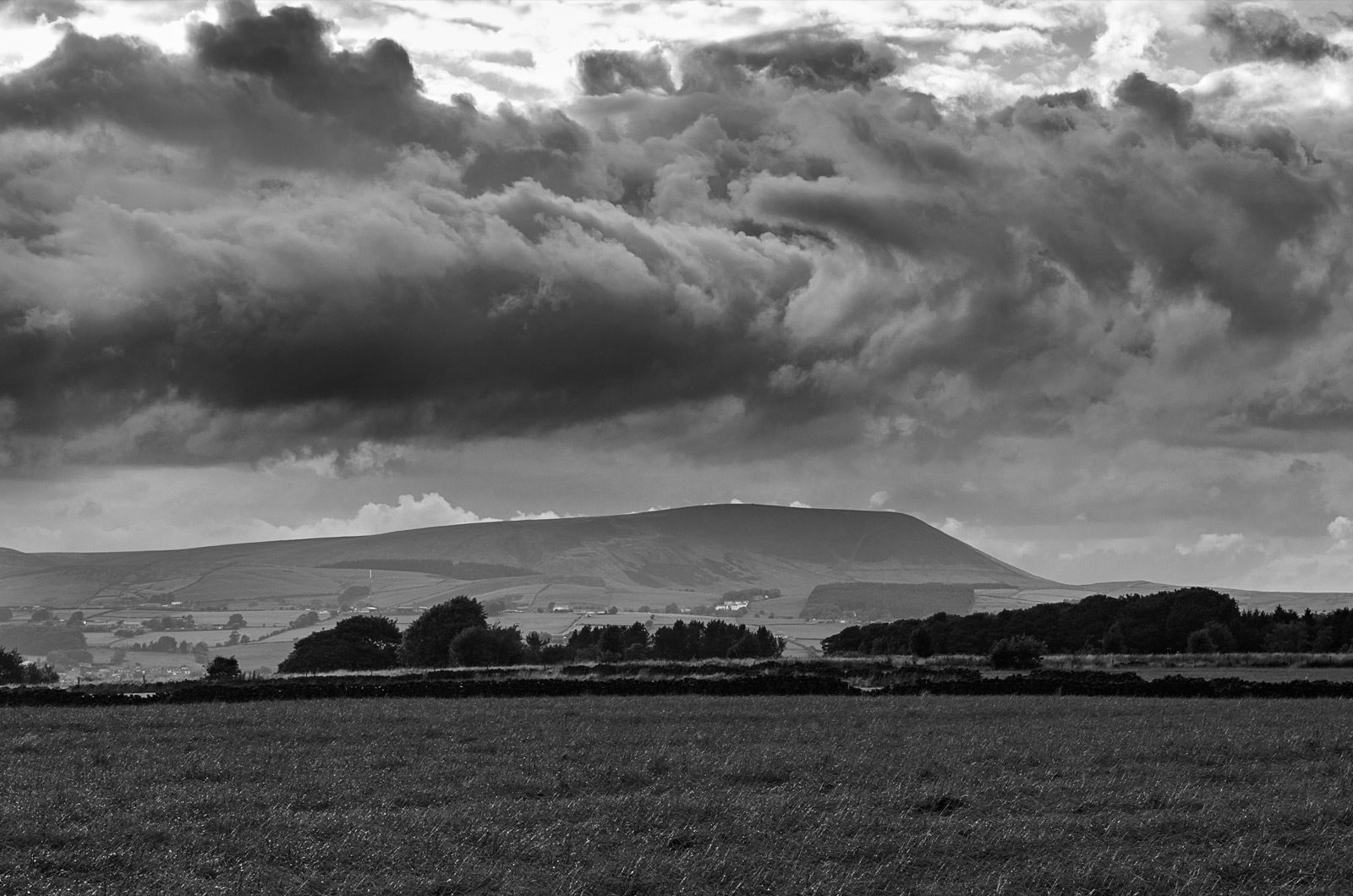 Pendle Hill under storm clouds