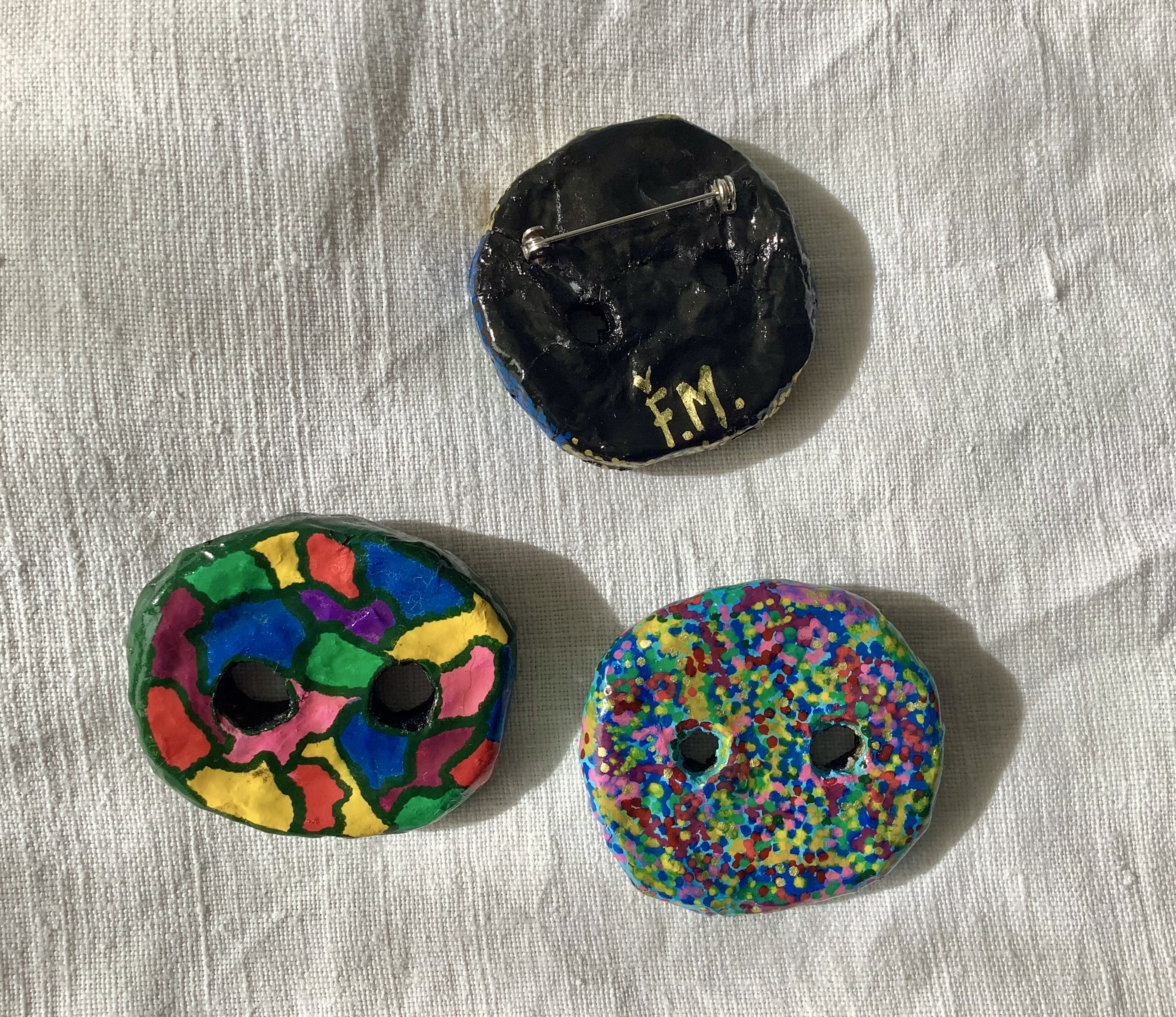 Giant buttons brooches