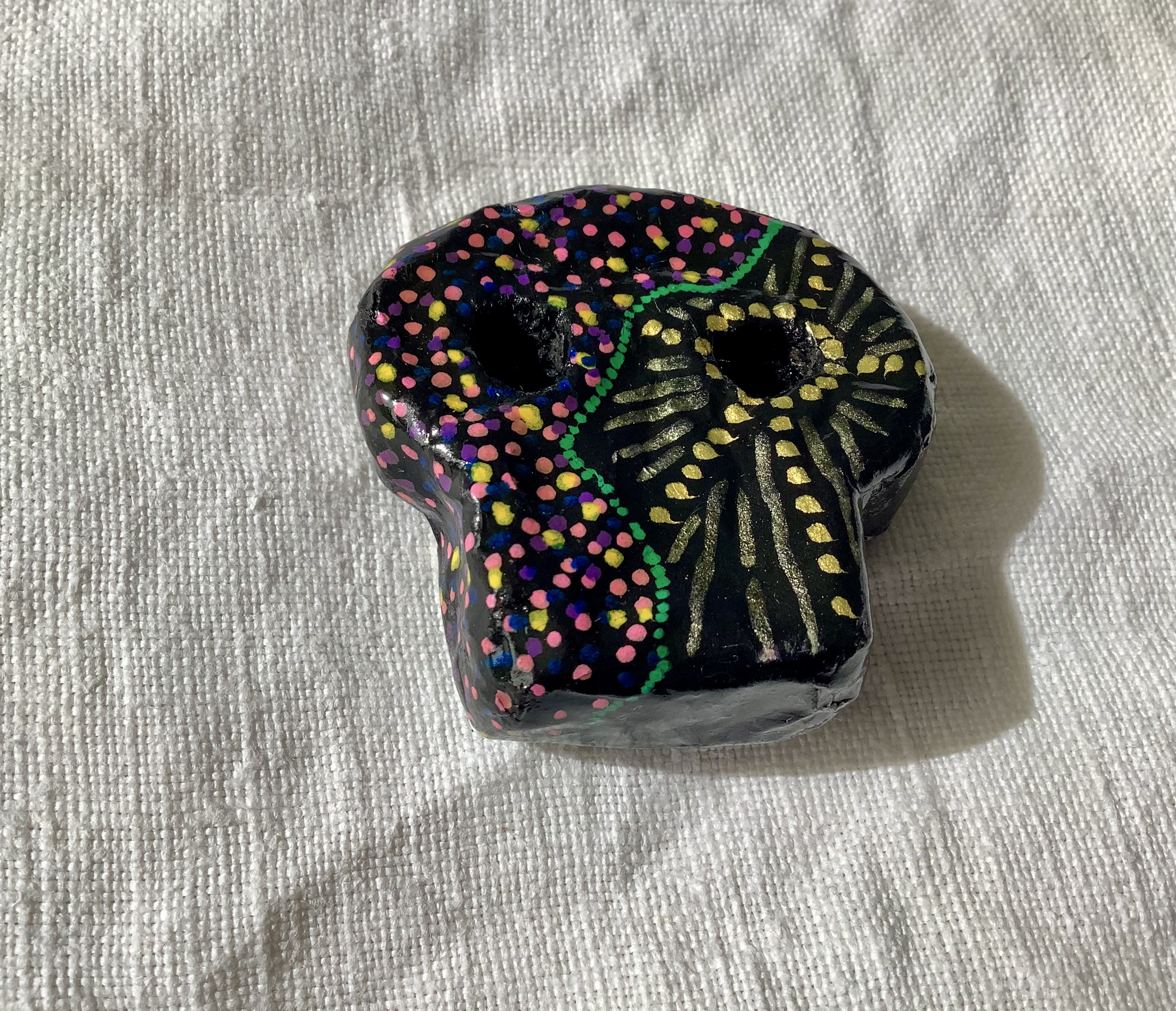 Skull brooch