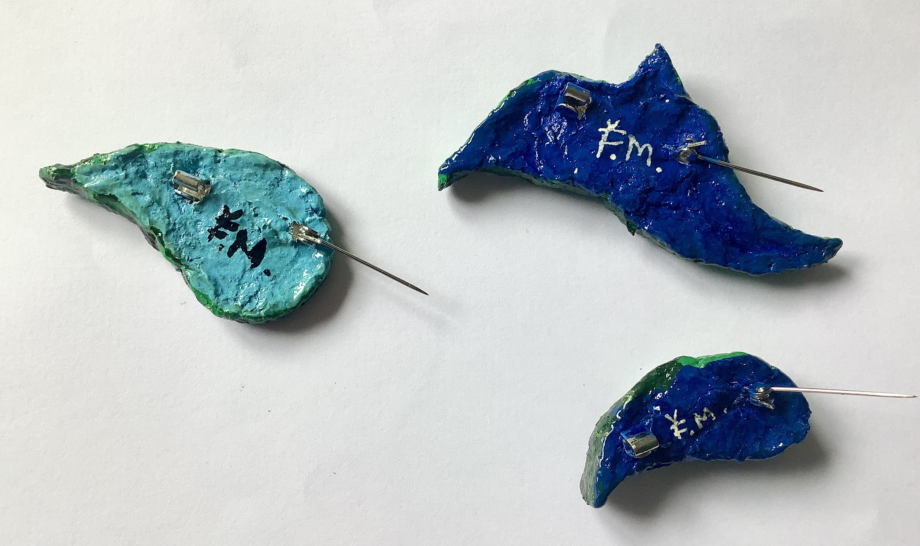 Leafy green brooches