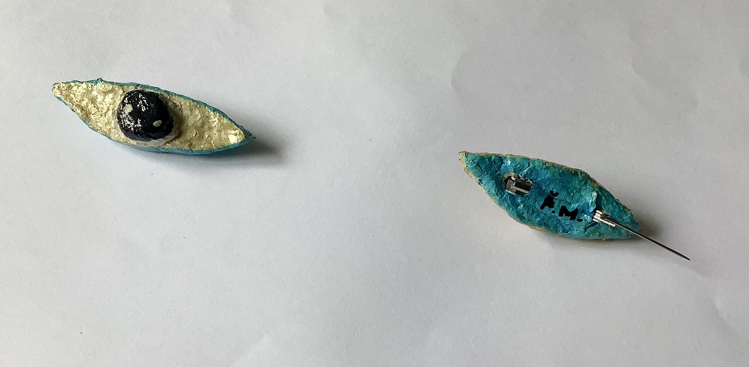 Eye brooches