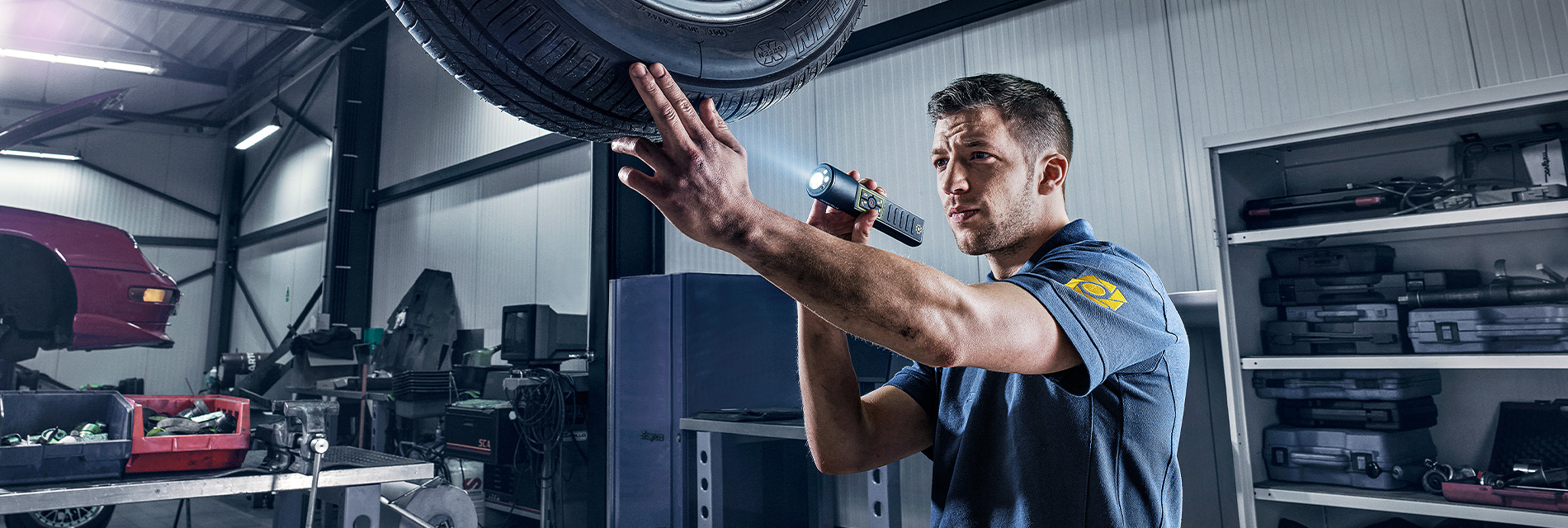 A mechanic holding an inspectron witorch