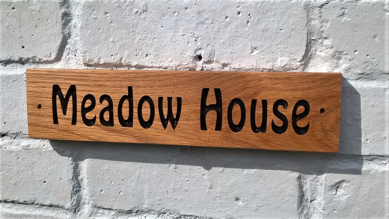 wooden house sign