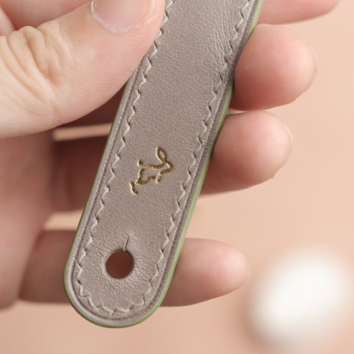 merri bunny logo on Grey leather close-up