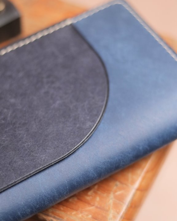 blue Peregrine passport wallet back close up