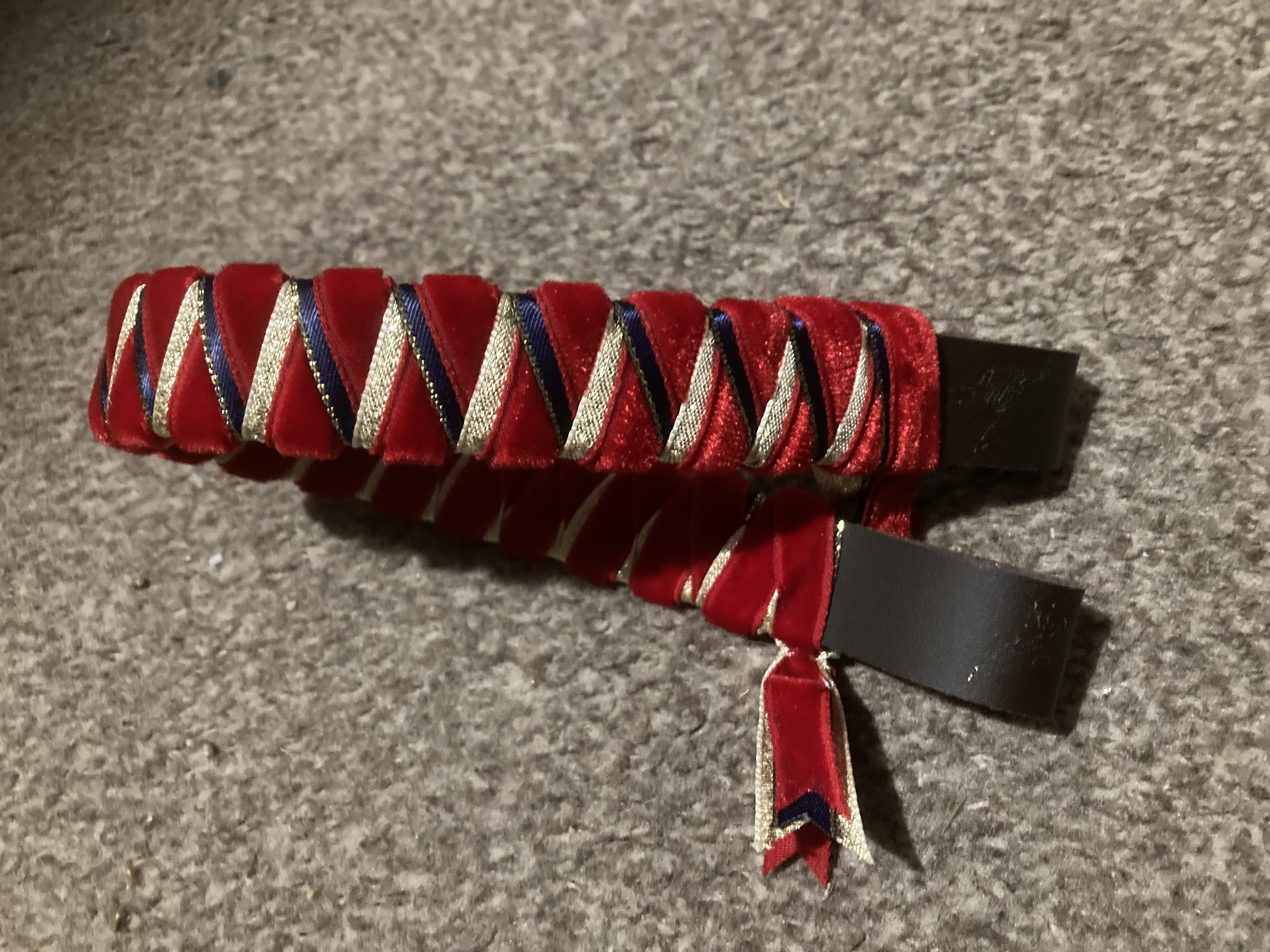 Red/Navy/Gold sharkstooth ribbon browband. 15” brown leather base.