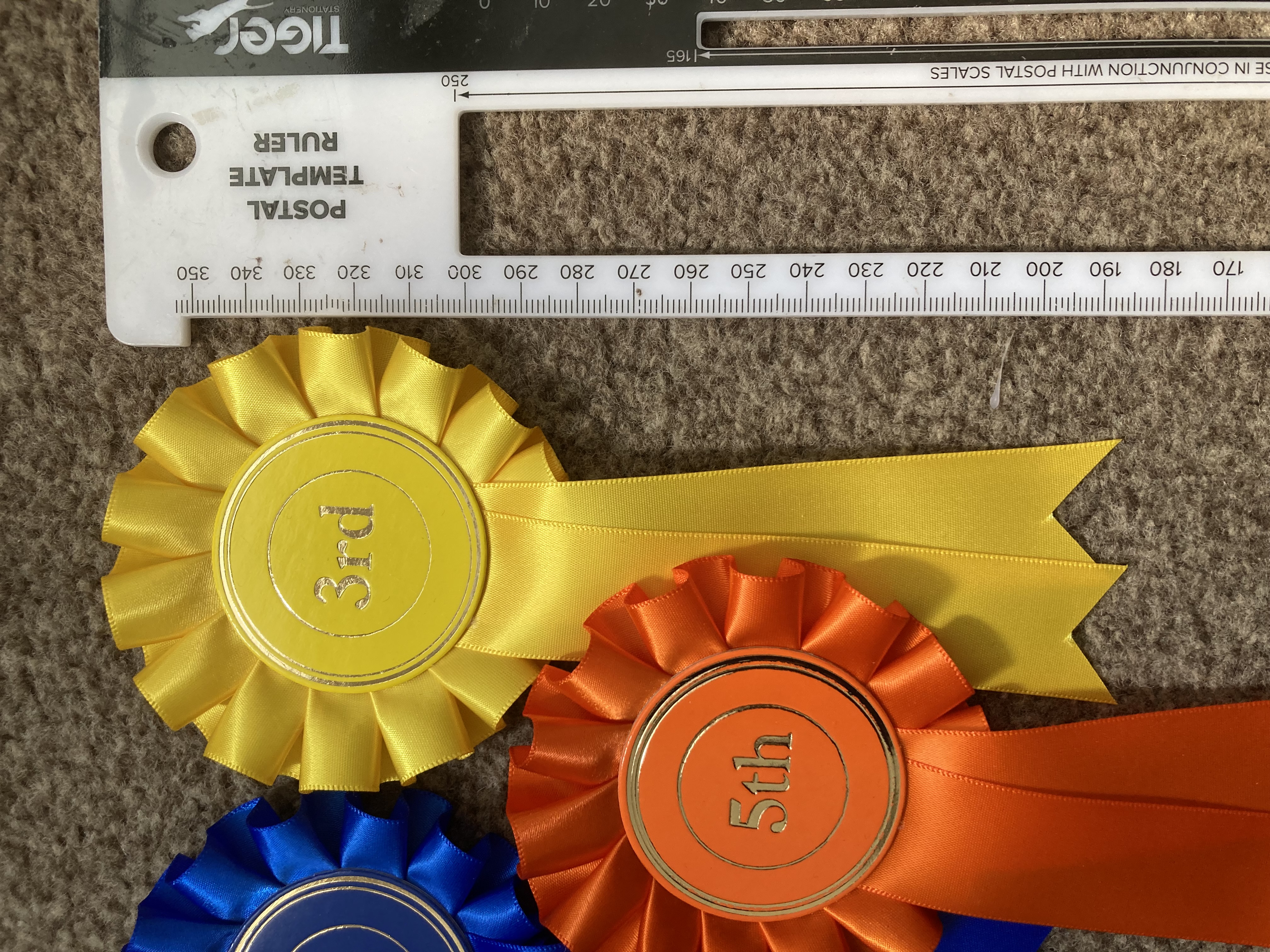 1st to 5th one tier rosettes. 50mm centres.