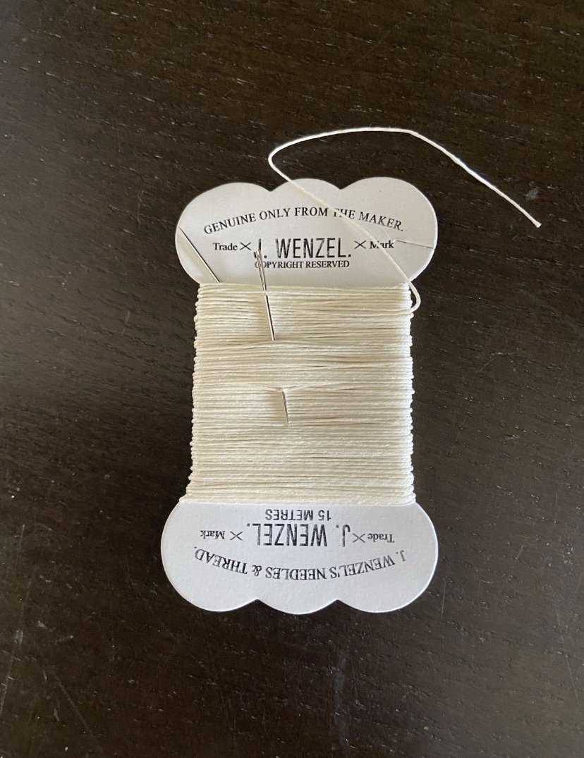 15m Wenzels waxed plaiting thread. Brown or Cream. With needle.