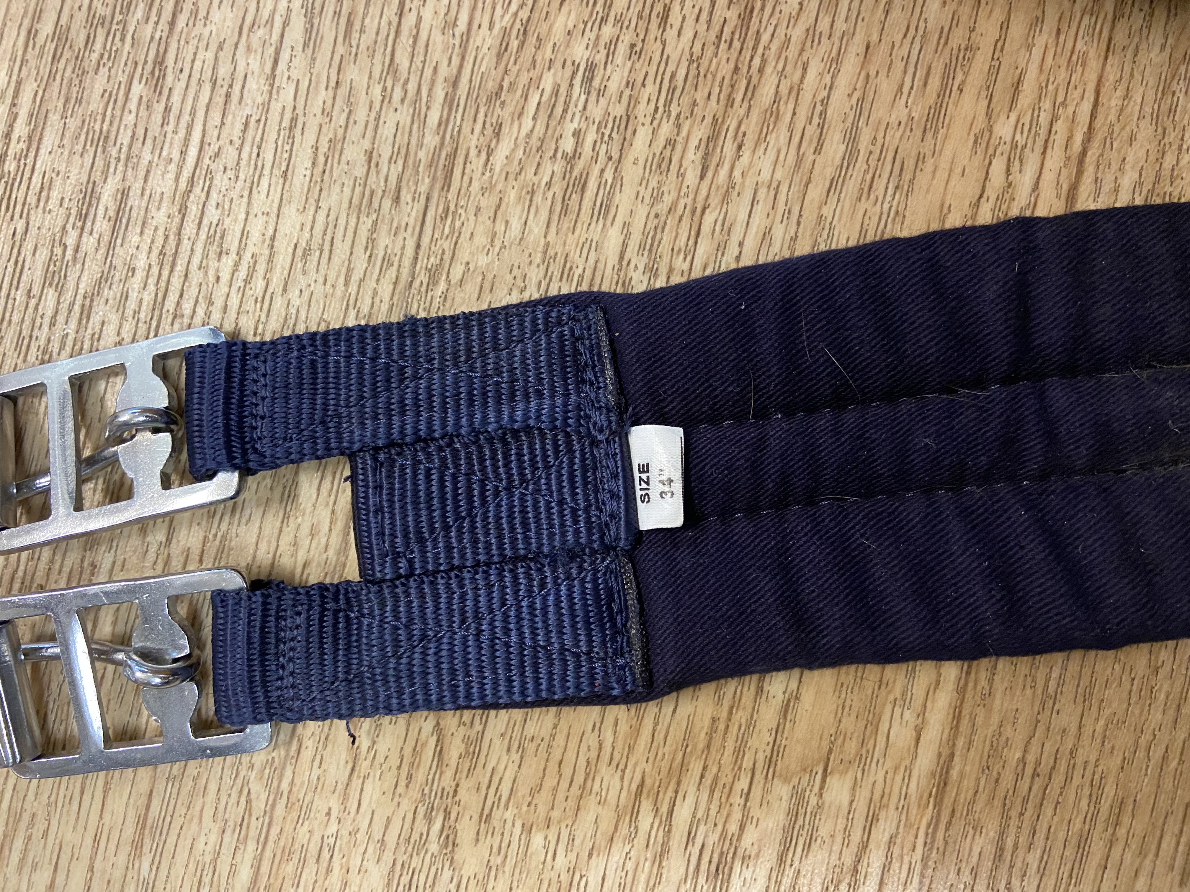 Navy nylon padded girth. 34”. Preowned. Used once.