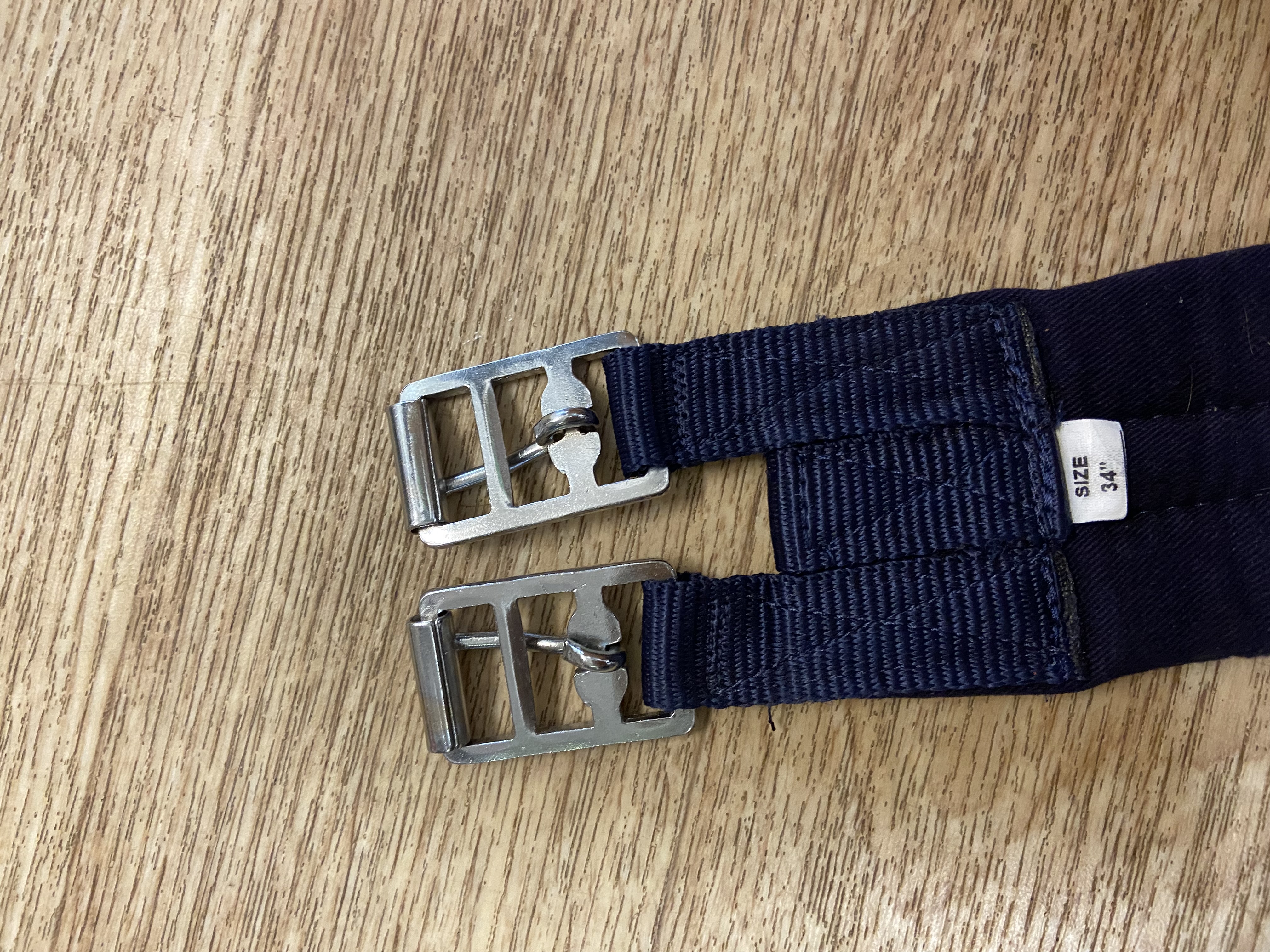 Navy nylon padded girth. 34”. Preowned. Used once.