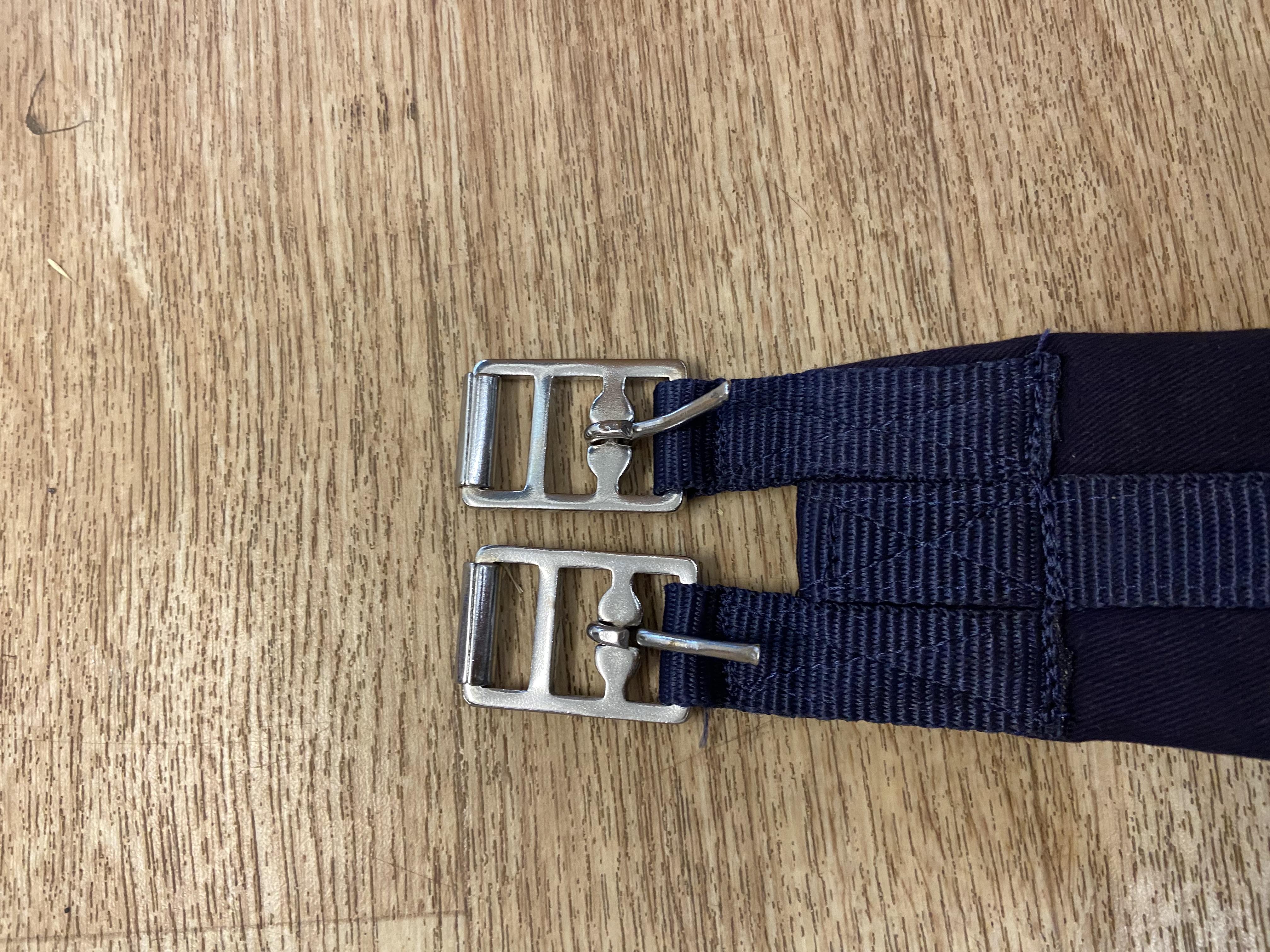 Navy nylon padded girth. 34”. Preowned. Used once.