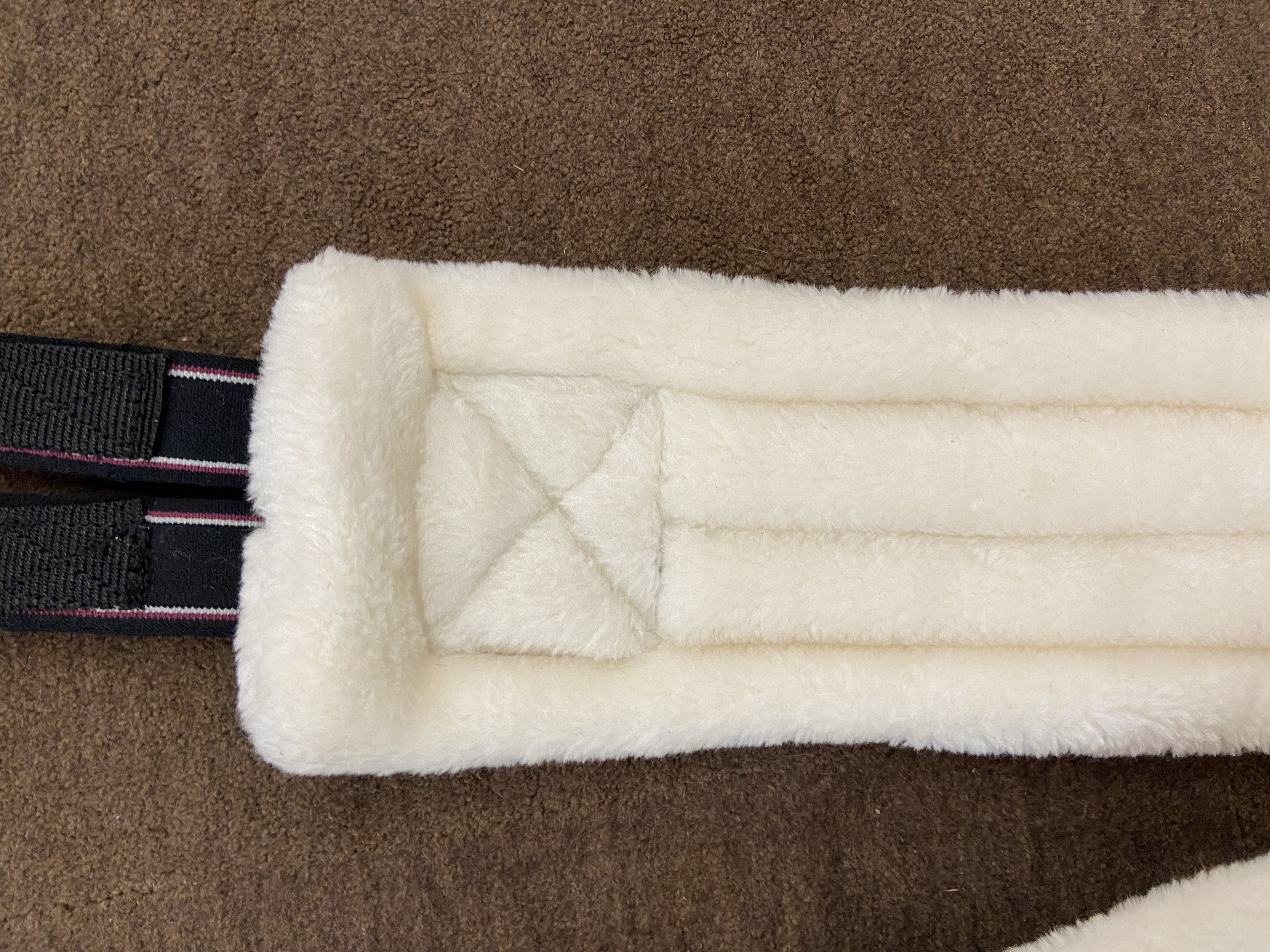 Fluffy girth with elasticated ends. Various colours and sizes. Brand-new without tags.