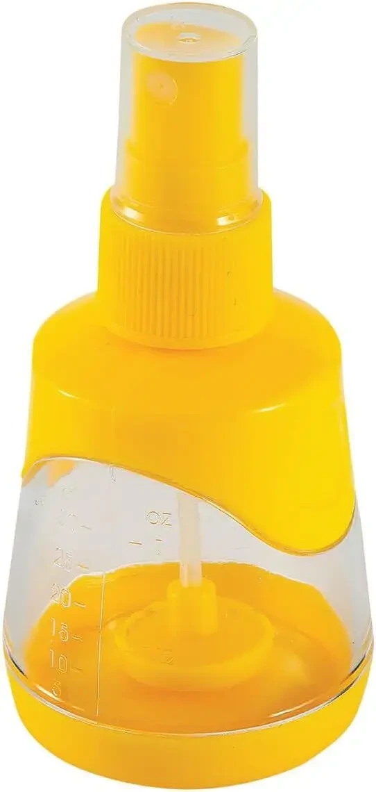 A hand easily squeezing a lemon with the Core Kitchen juicer attachment.