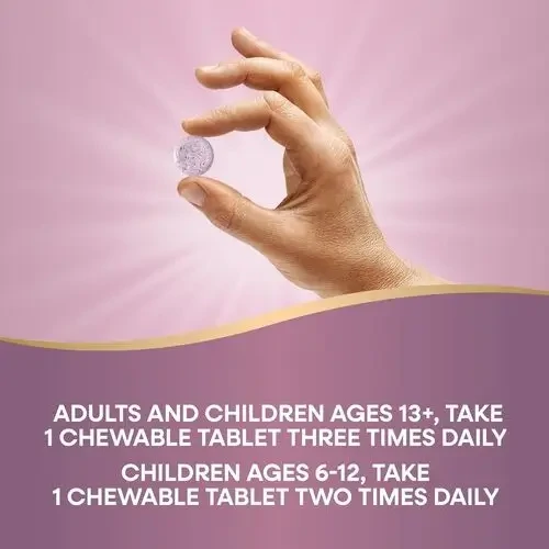 A person conveniently taking a chewable Umcka tablet, highlighting the ease of use without needing water.