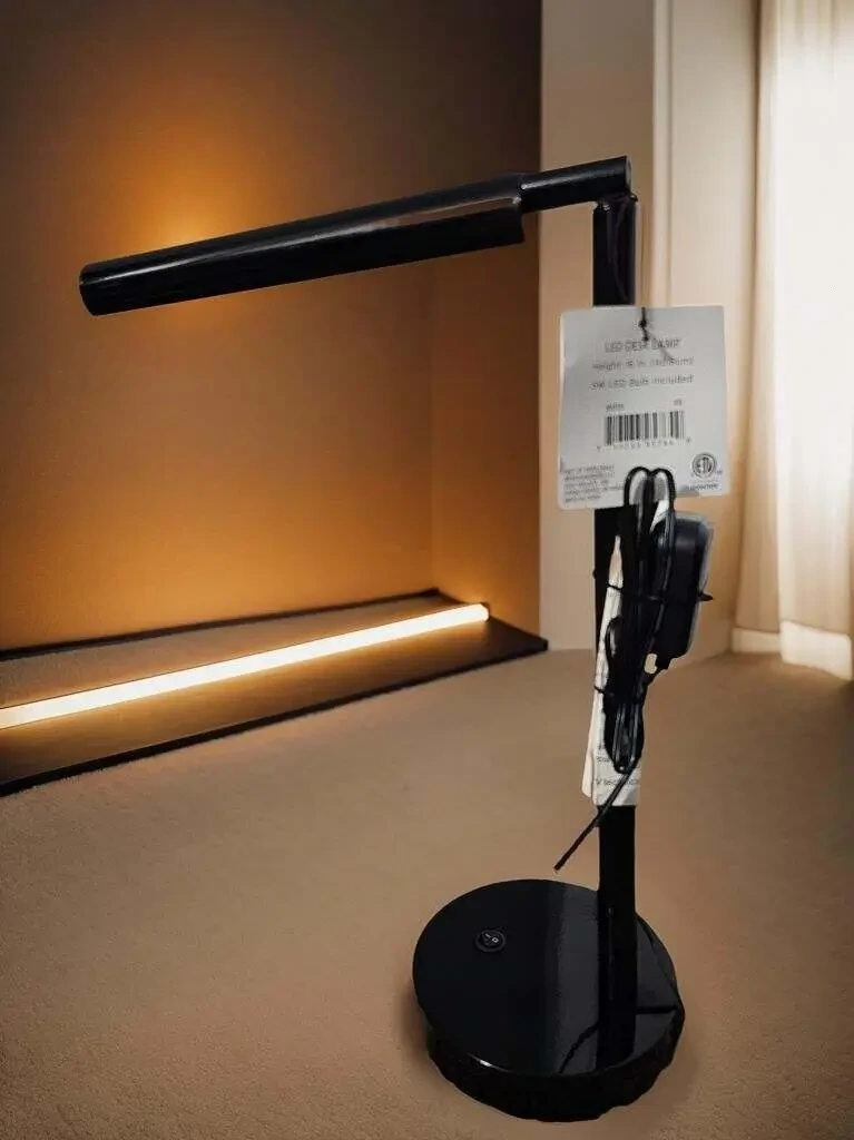 Modern 16 inch black desk lamp in use for focused task lighting