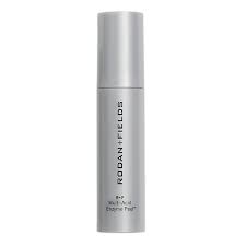 A luxurious, golden serum drop of the R+F Multi-Acid Enzyme Peel on a clean, white surface, showcasing its texture.