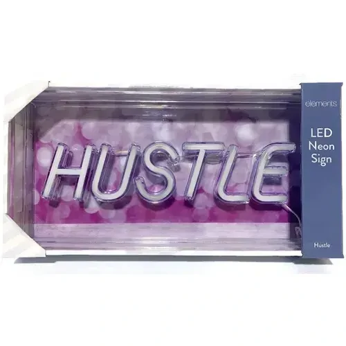 HUSTLE LED Neon Sign in hot pink glowing in a workspace
