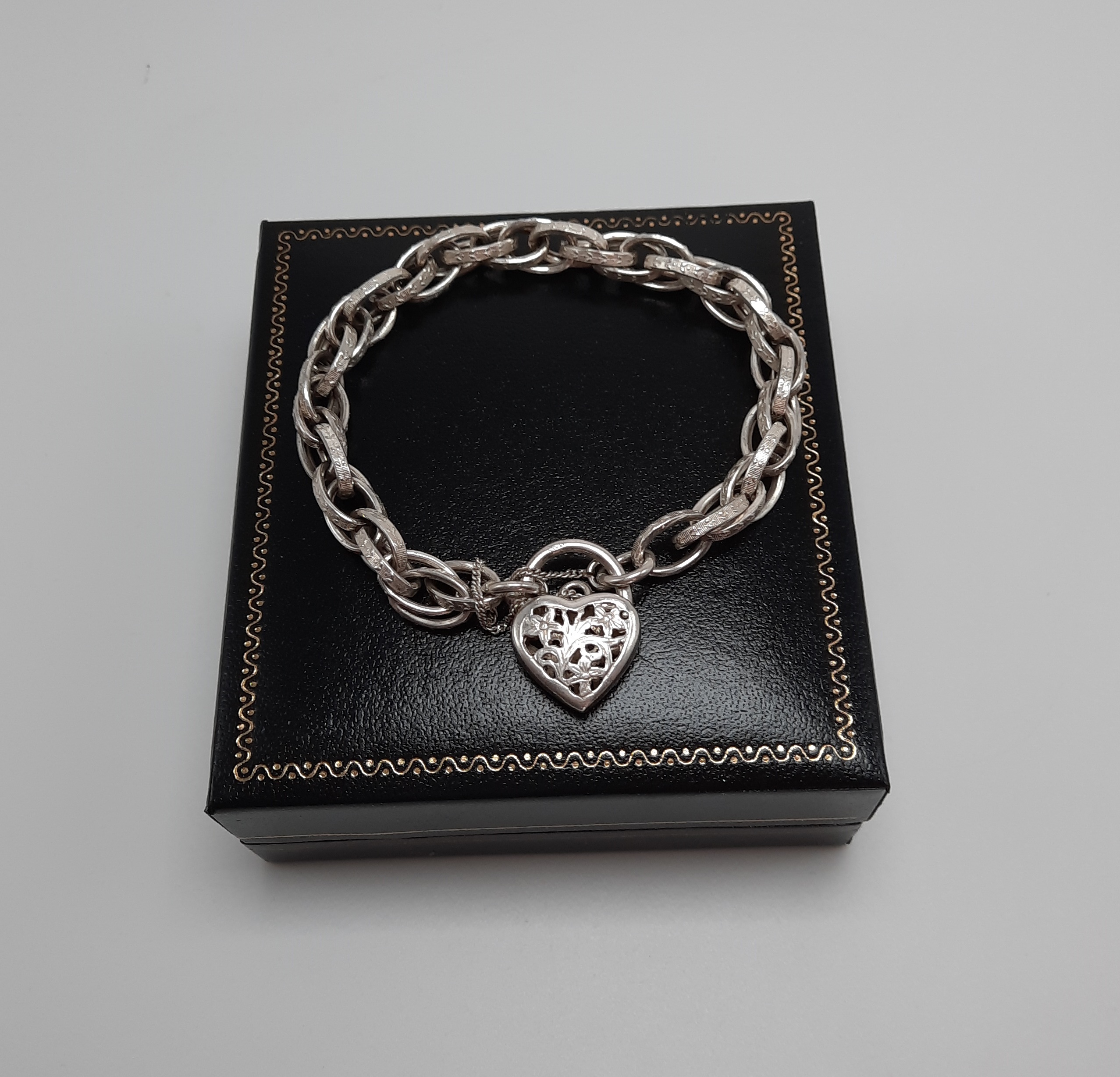 Sterling Silver Fancy Link Bracelet with Floral Pierced Padlock