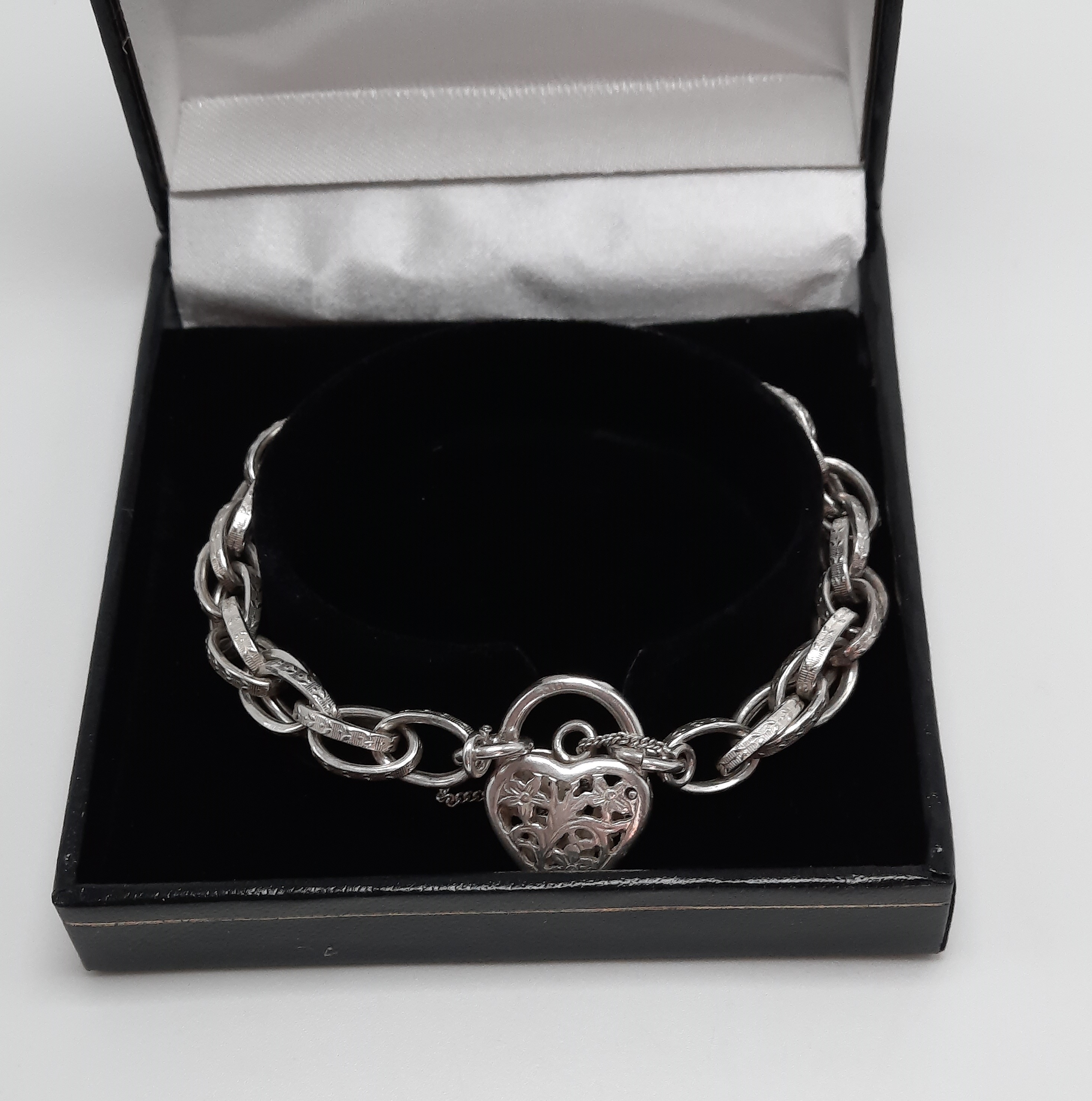 Sterling Silver Fancy Link Bracelet with Floral Pierced Padlock
