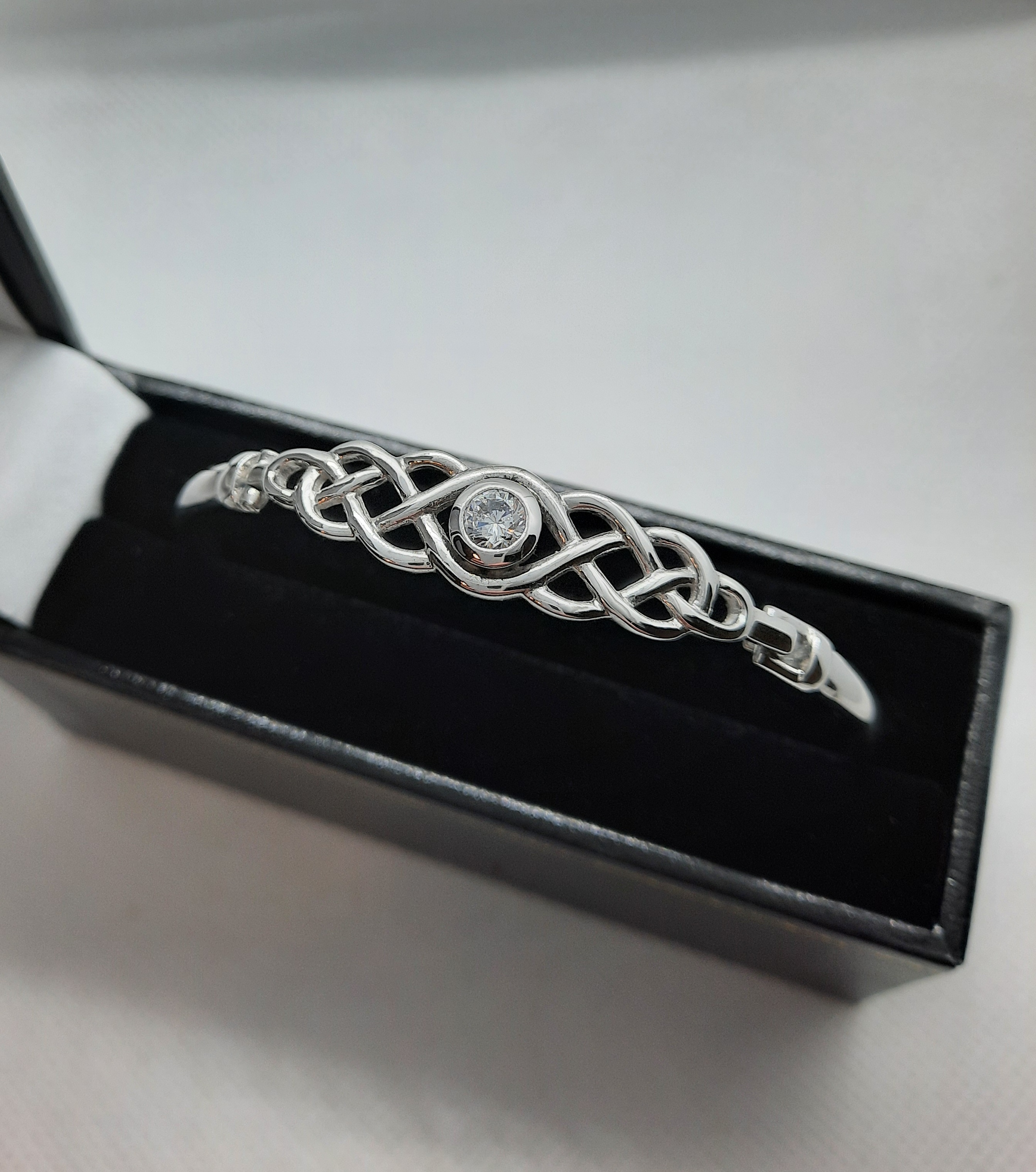Sterling Silver Celtic Knot Bangle set with a Clear Stone