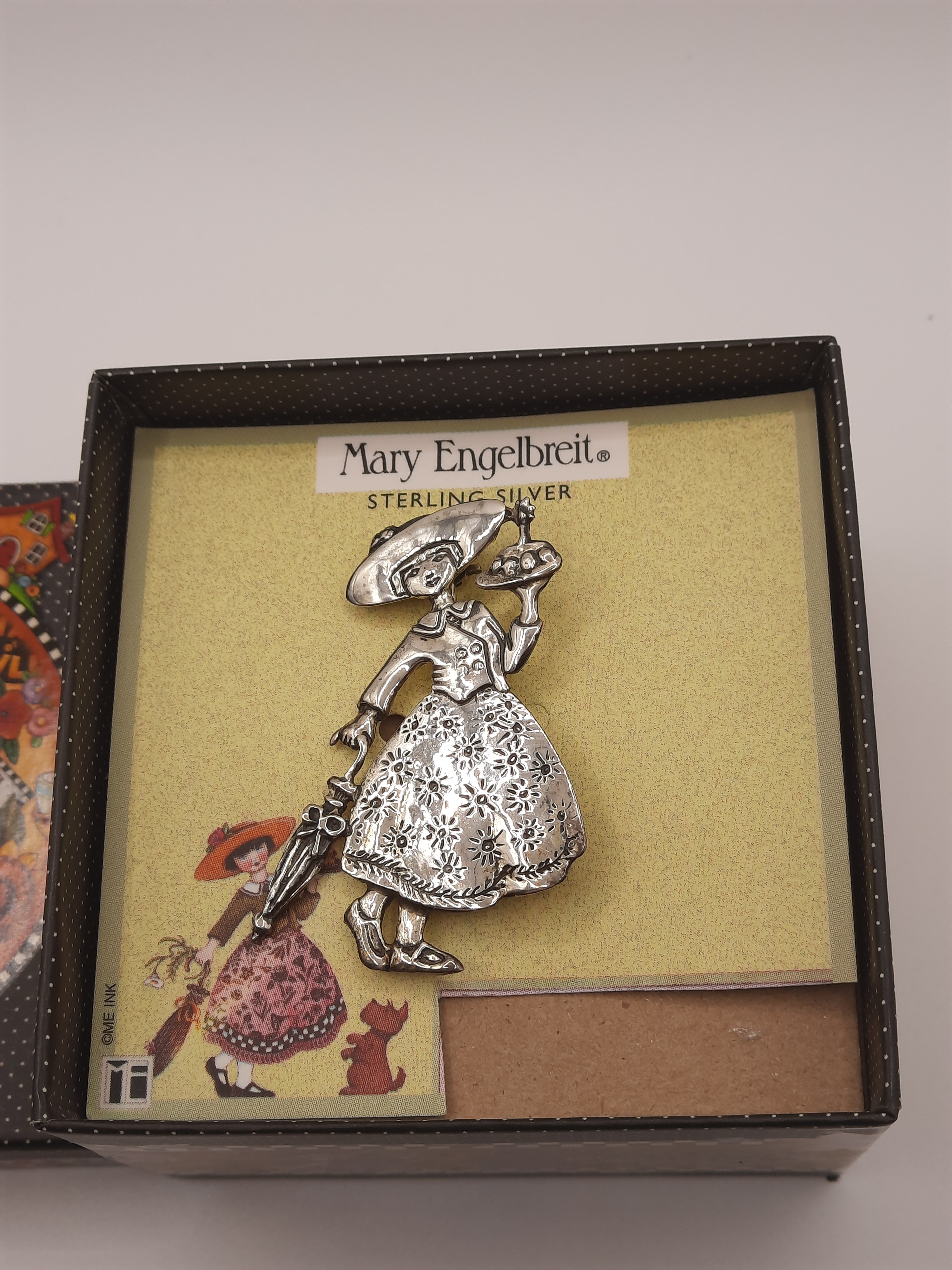 Mary Engelbreit Female Figure with Umbrella and Cake Brooch in Sterling Silver