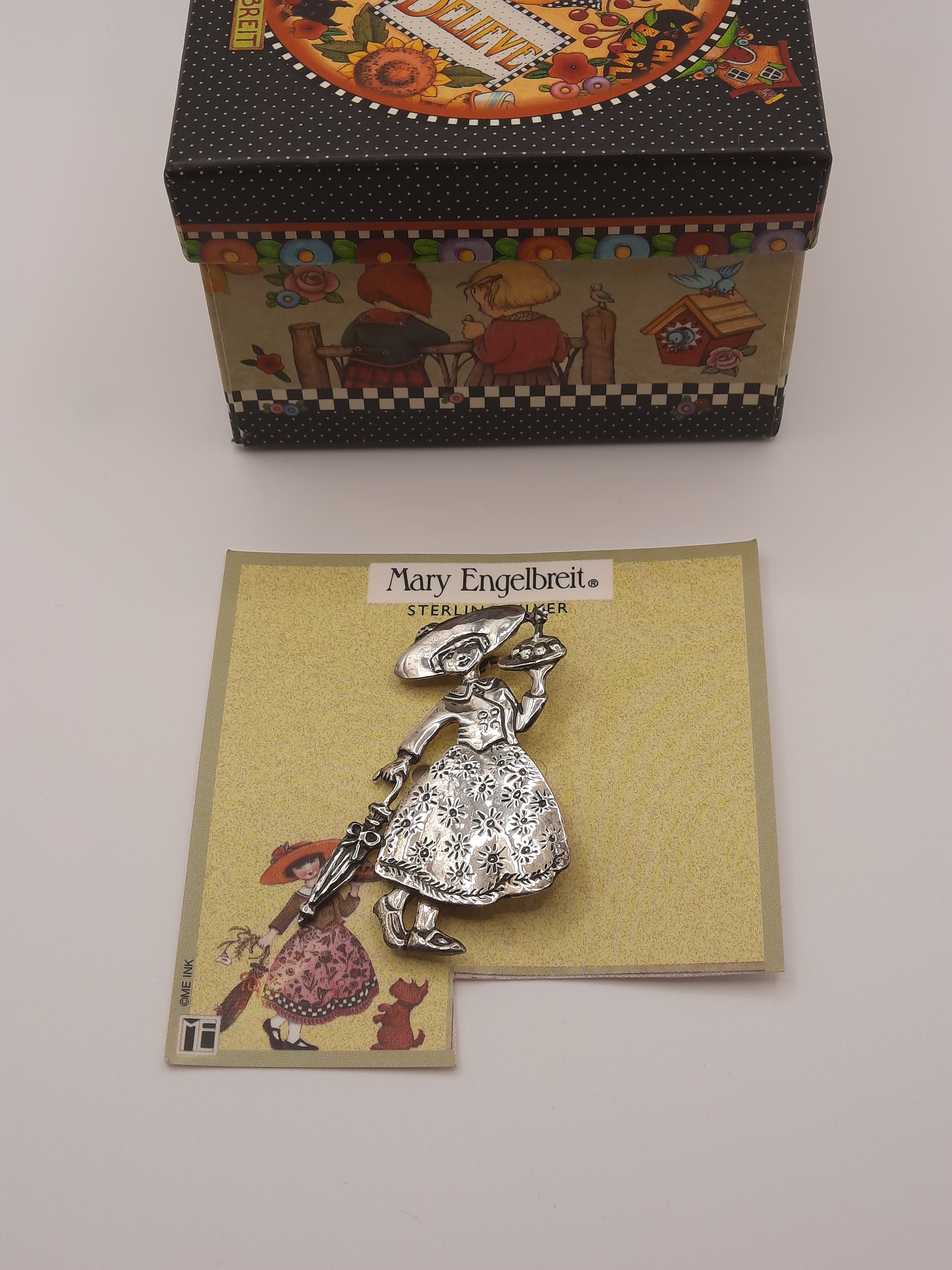 Mary Engelbreit Female Figure with Umbrella and Cake Brooch in Sterling Silver