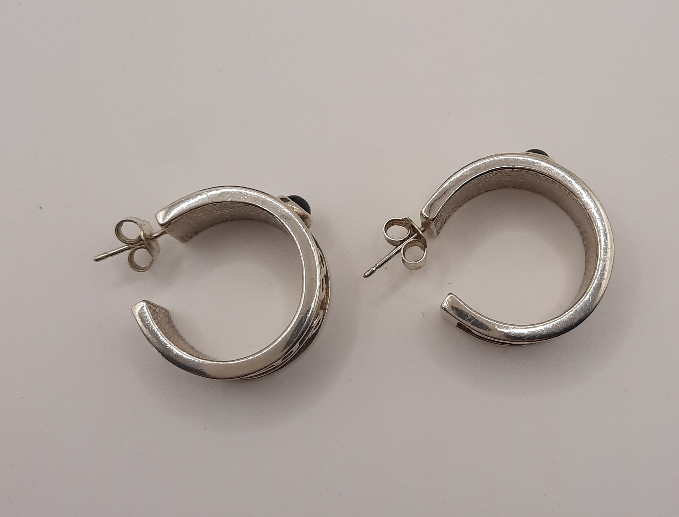 Unusual Ortak Thick Sterling Silver Half Hoop Earrings set with Garnets