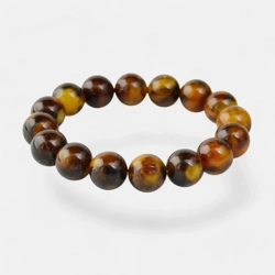 What is the difference between natural, modified, and pressed amber bracelets?