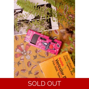 Custom hand-painted Agfamatic 3008 film camera with colorful artistic design